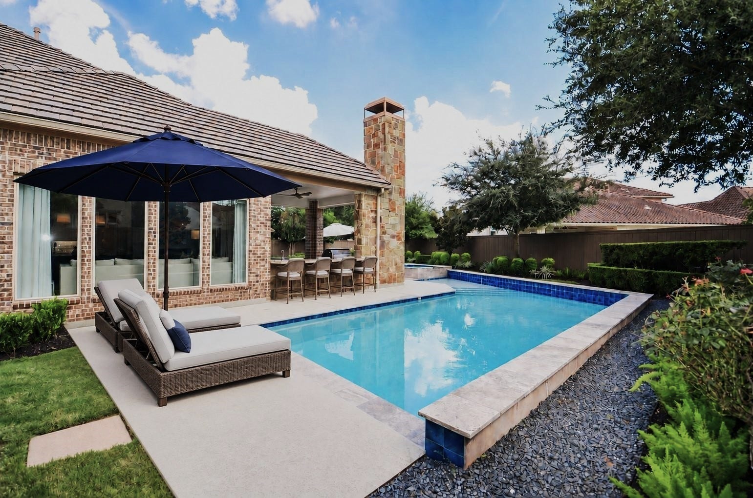 86 Quiet Way Lane, Sugar Land, TX 77498 Virtually staged with barstools at the outdoor kitchen and chaises to enjoy this private pool area. Enjoy outdoor living with multiple seating areas surrounding the pool and spa