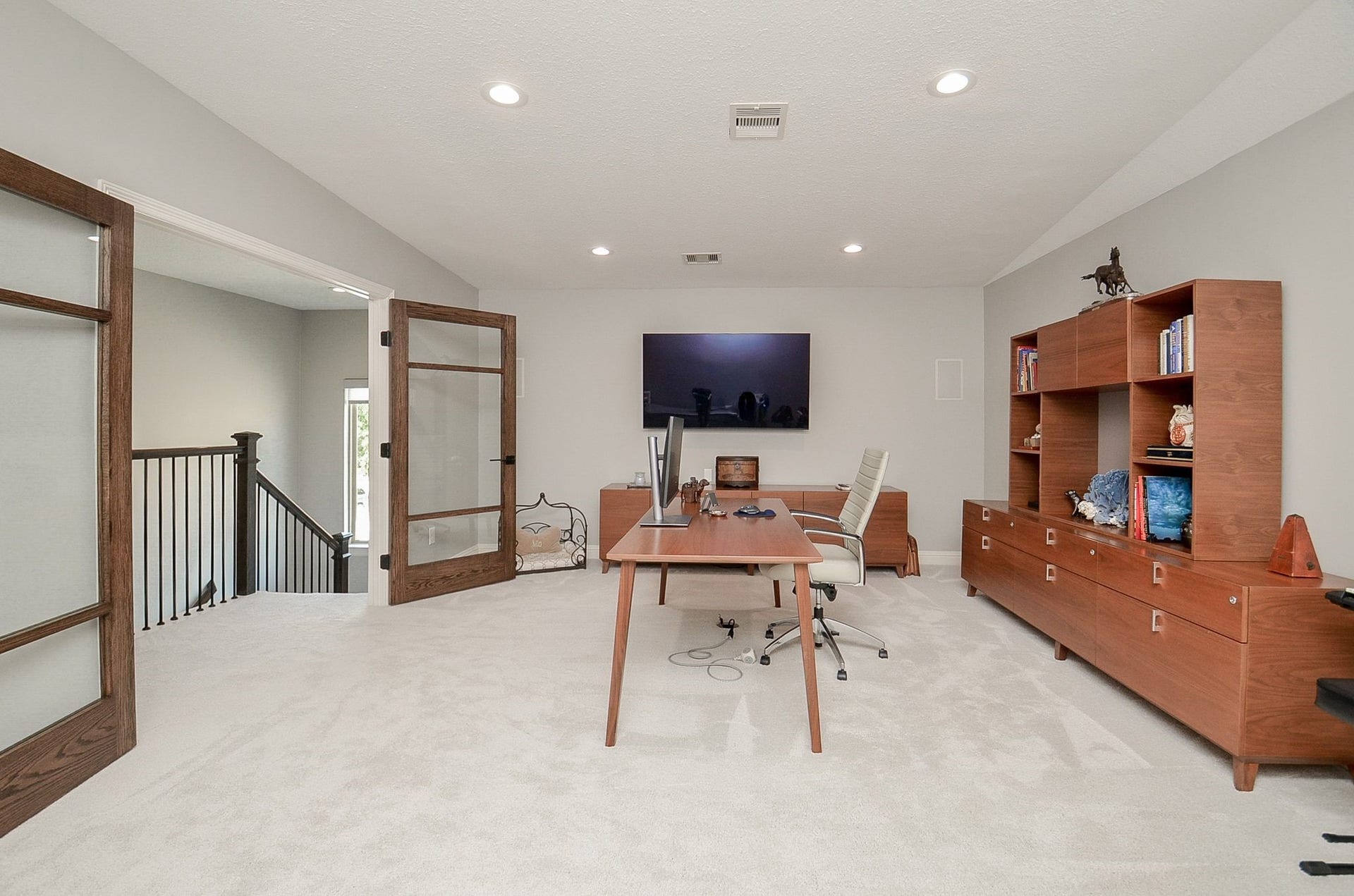 86 Quiet Way Lane, Sugar Land, TX 77498 Custom double doors open to expansive upstairs game room which is currently used as a home office and offers endless possibilities.