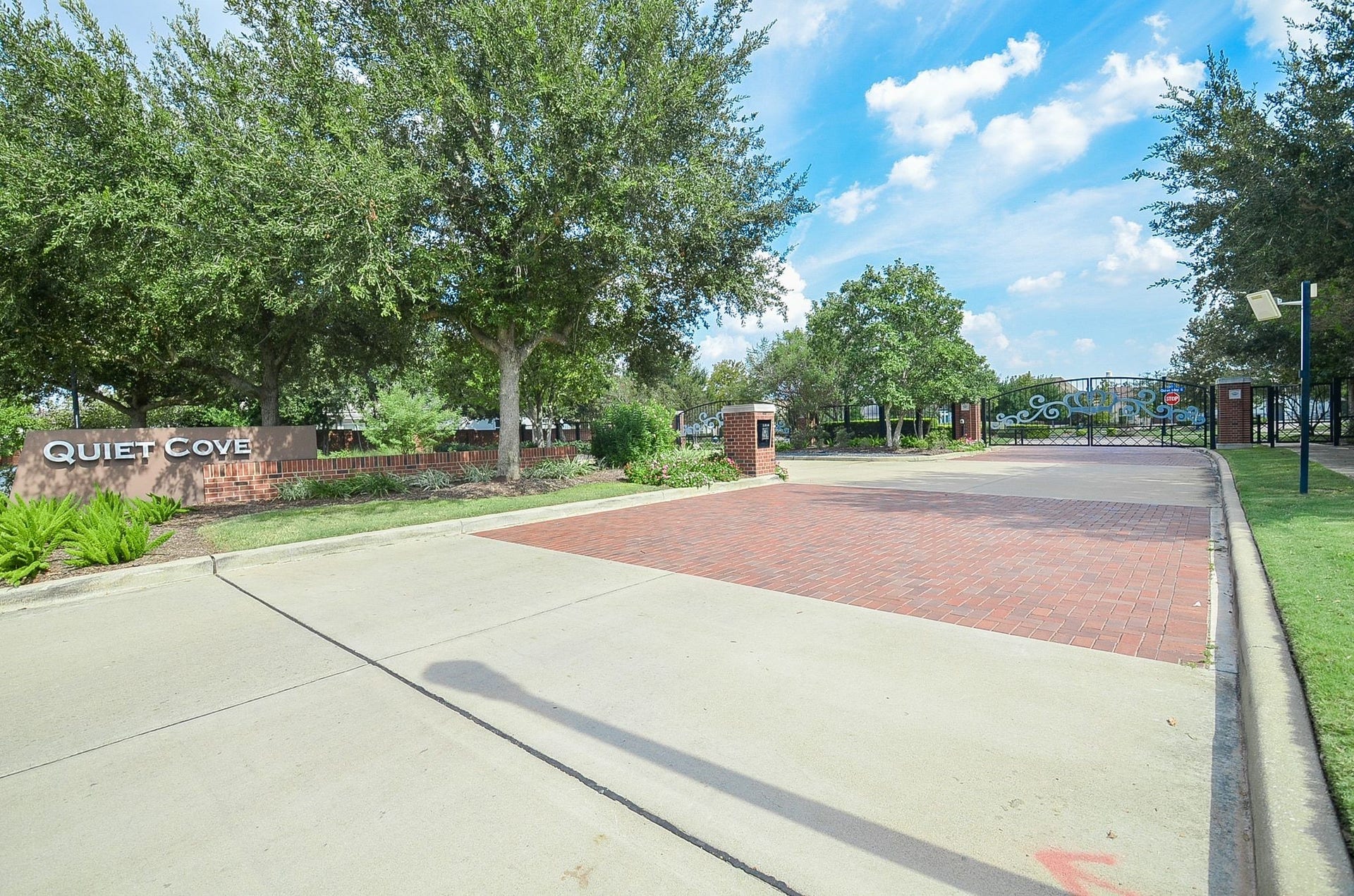 86 Quiet Way Lane, Sugar Land, TX 77498 A gated entrance welcomes residents and visitors to Quiet Cove, a sought-after enclave within Imperial, offering an added sense of privacy.