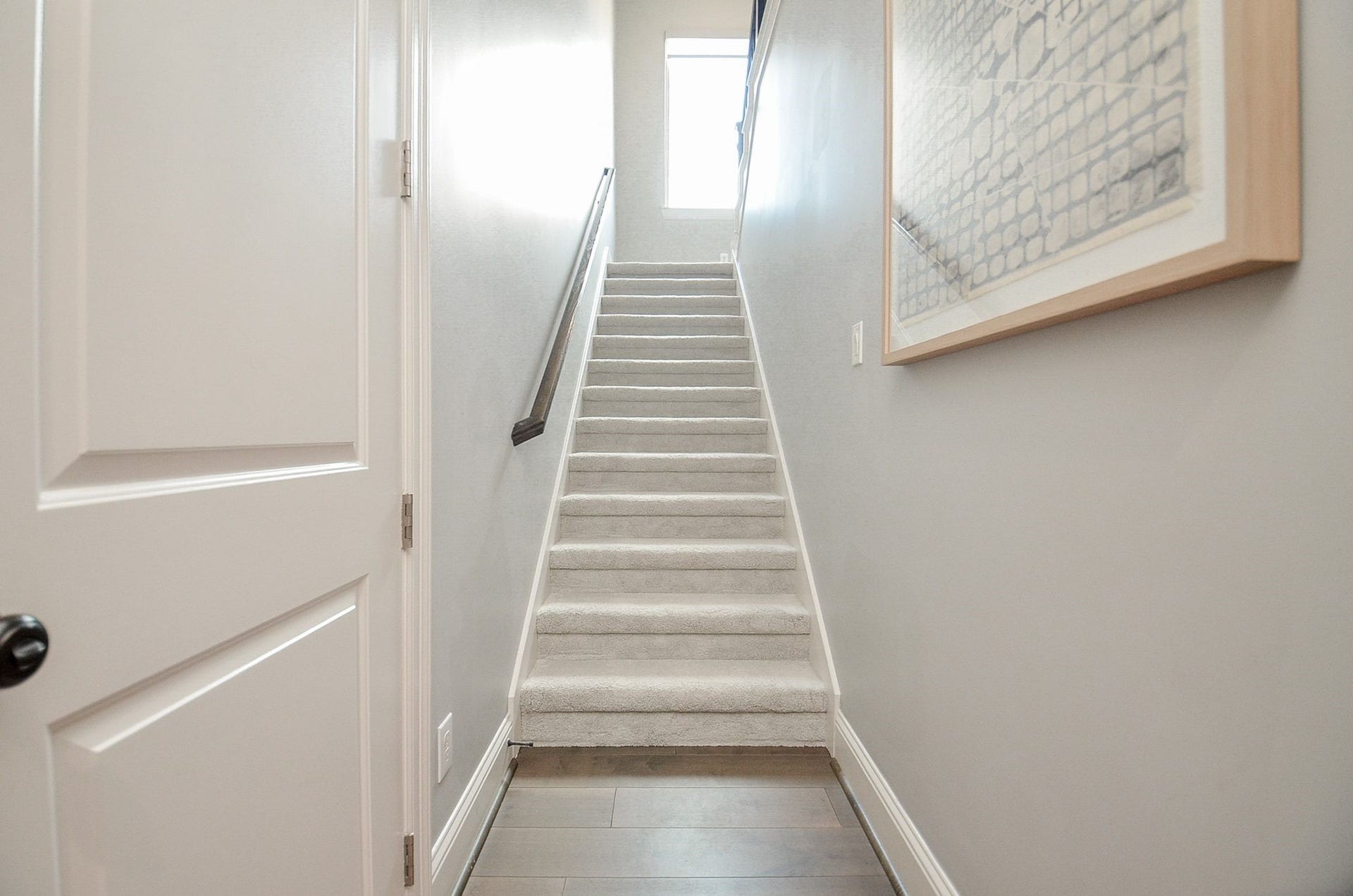 86 Quiet Way Lane, Sugar Land, TX 77498 This staircase leads to the upstairs game room and media, creating a dedicated entertainment retreat apart from the home's other living areas downstairs.
