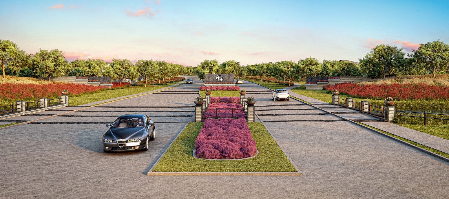 Landscaped community boulevard showcasing the neighborhood's thoughtfully designed entrance and scenic surroundings.