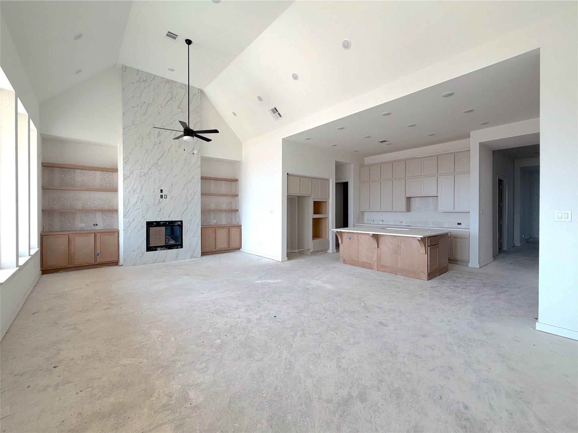 Inviting living area with cozy fireplace and seamless flow to the kitchen