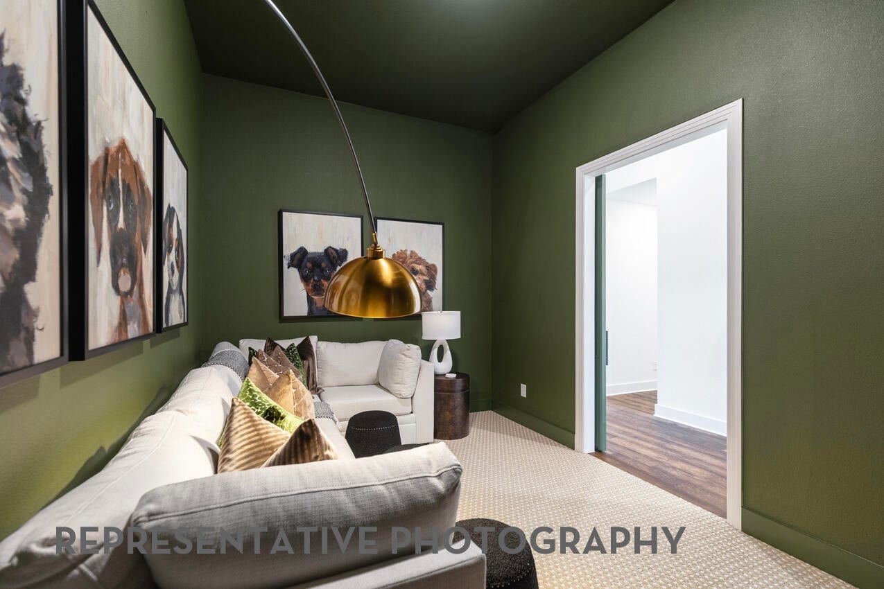 Versatile entertainment room ideal for a media lounge, home office, or additional living space.