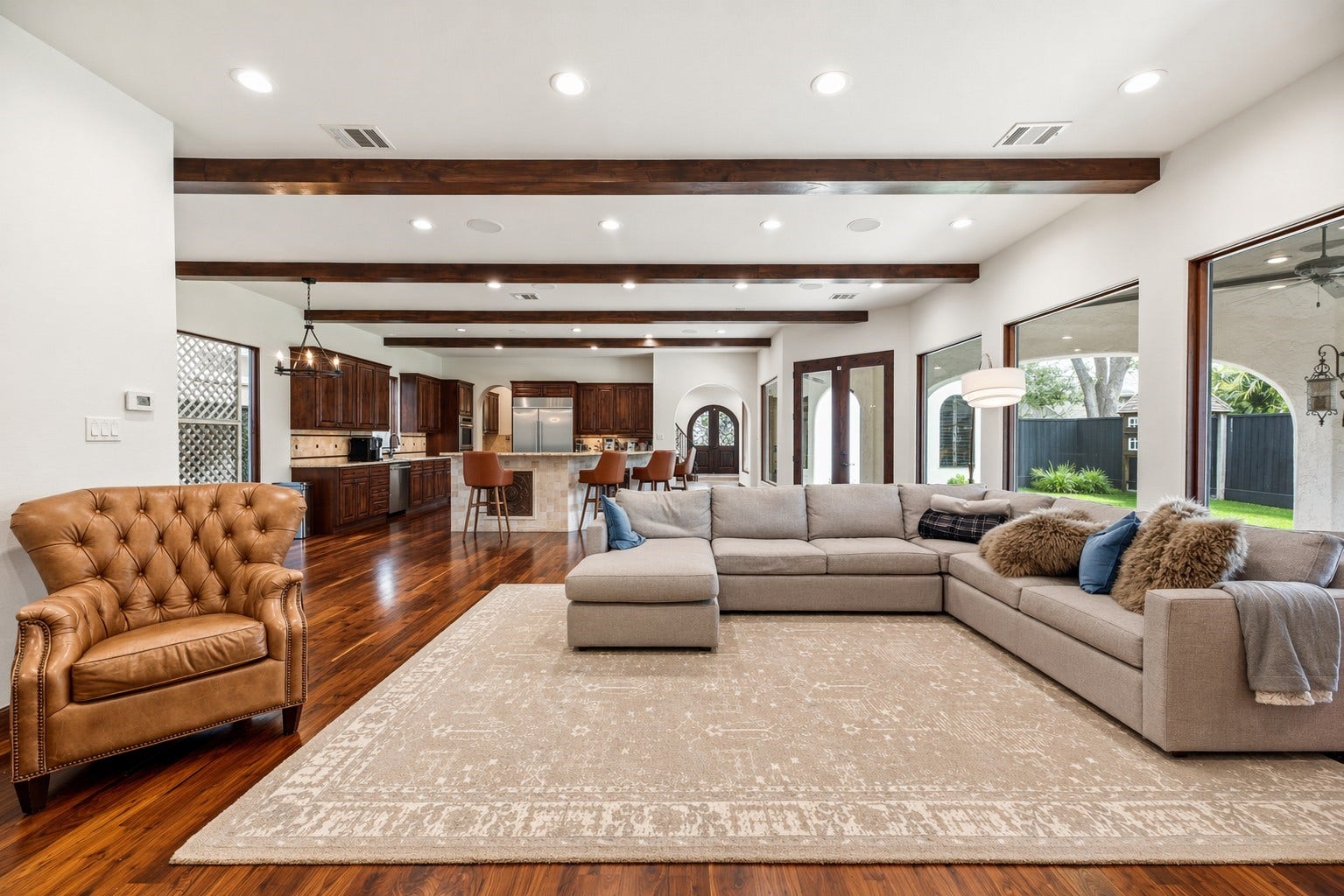 3803 Drake Street, Houston, TX 77005 This alternative view of the living room highlights the open-concept layout and custom woodwork, offering a perfect perspective of how the space connects to the heart of the home.