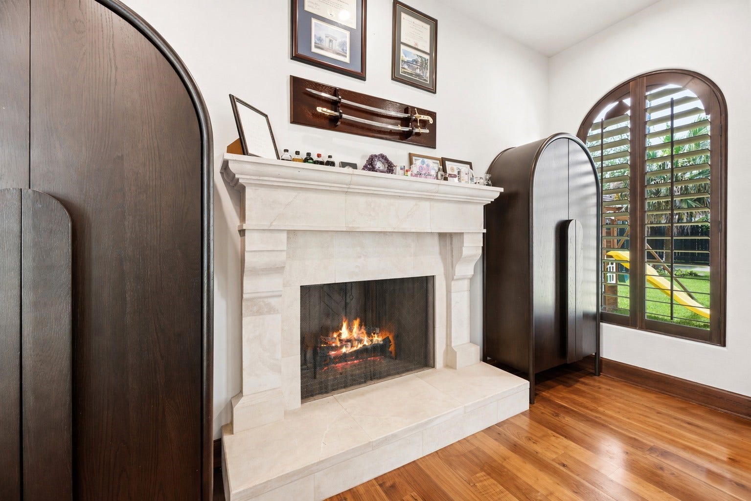 3803 Drake Street, Houston, TX 77005 A second gas-log fireplace with a custom stone mantel anchors the study, adding warmth and a sophisticated focal point to this versatile workspace.