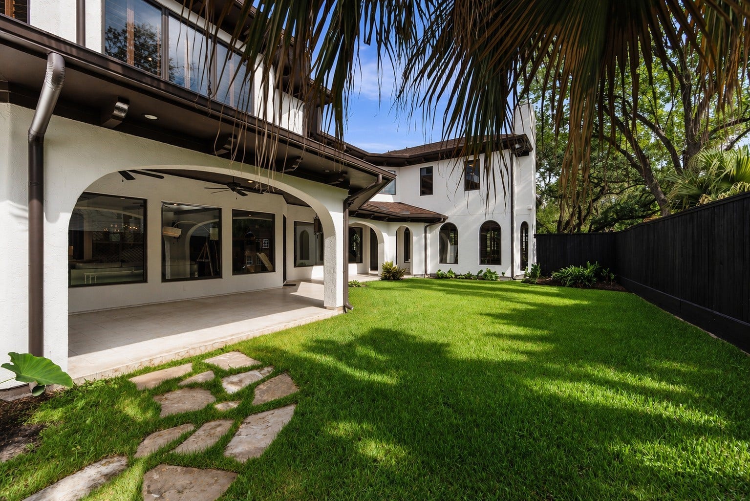 3803 Drake Street, Houston, TX 77005 The fully fenced backyard offers a lush, private retreat perfect for recreation or peaceful afternoons in the sun.