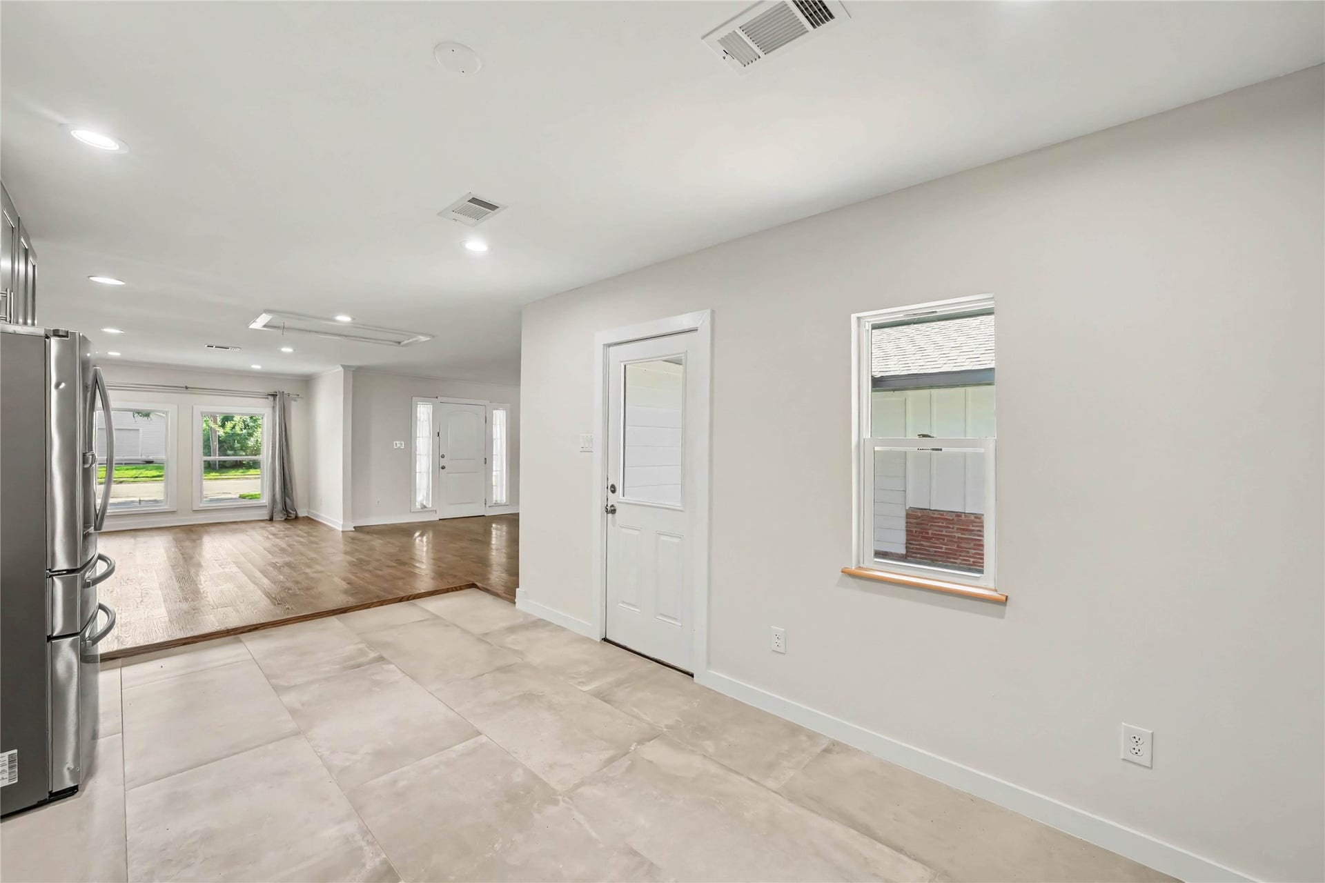4709 Sanborn Drive, Houston, TX 77092 The kitchen is complete with a door to the back patio and yard while being open to the dining and living areas.