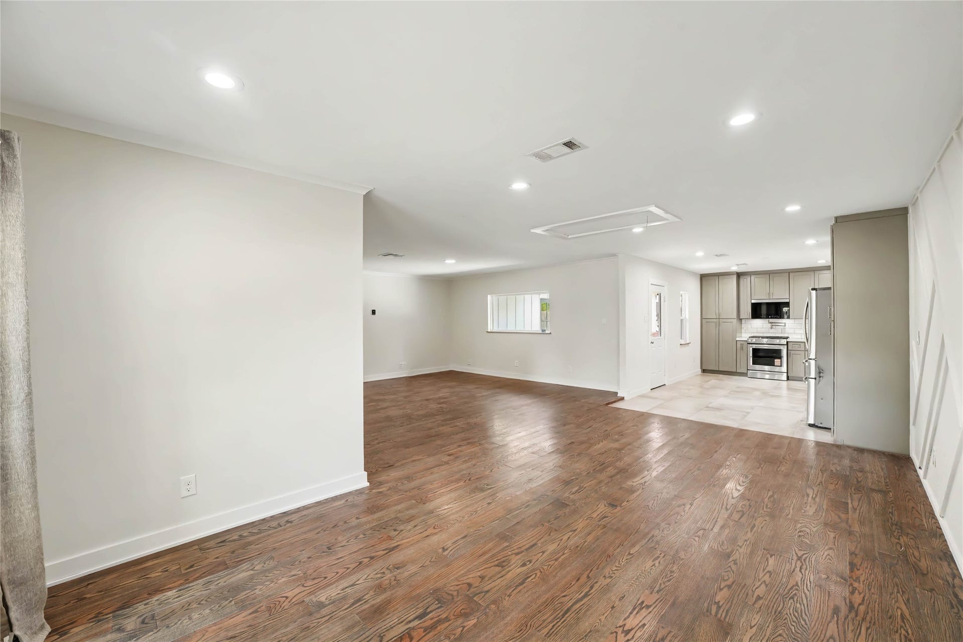 4709 Sanborn Drive, Houston, TX 77092 From the dining room, you can see into the kitchen but also notice the large picture window in the living area providing a great view to the rear patio and yard.