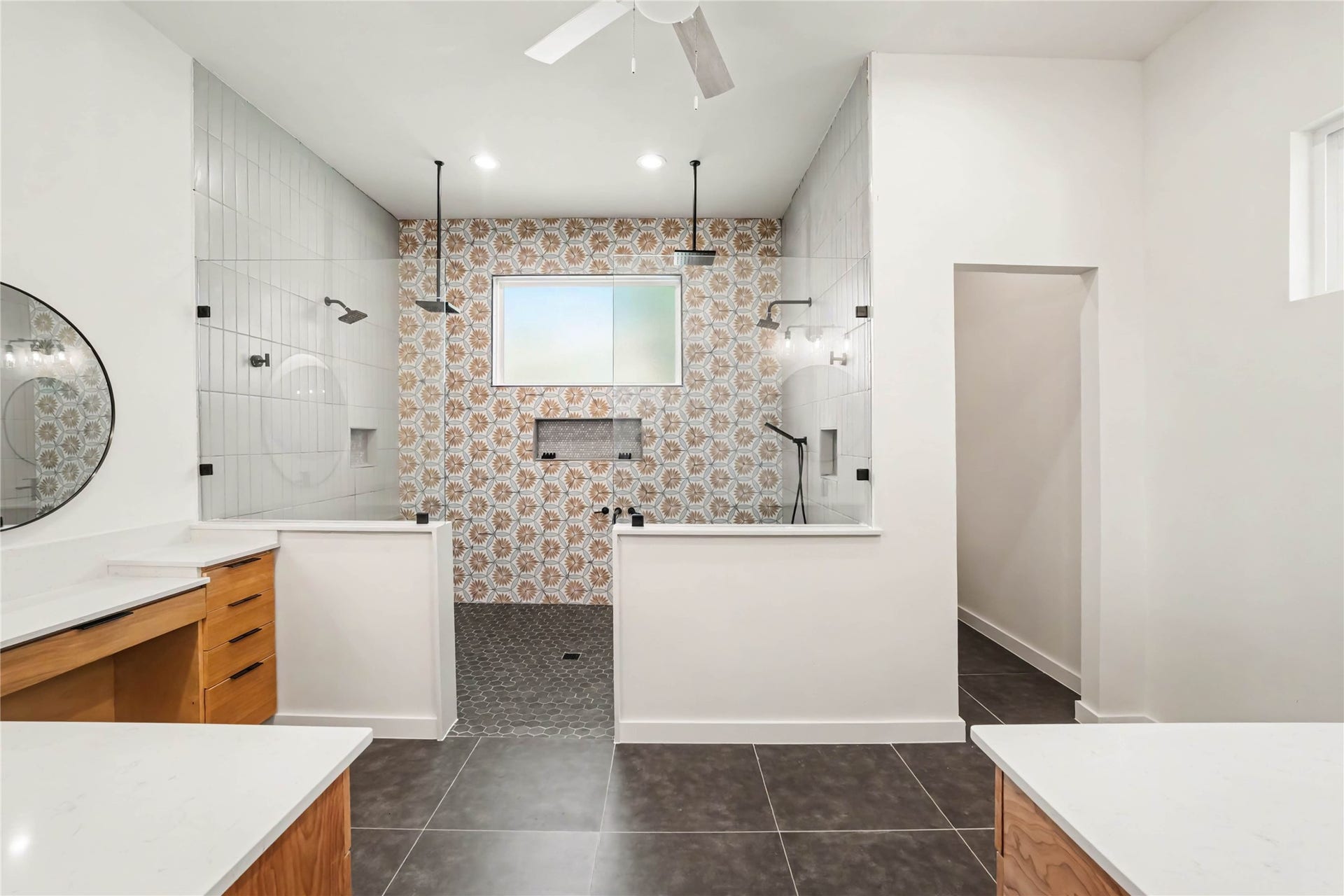 4709 Sanborn Drive, Houston, TX 77092 We have saved the best for last! Step out of the closet and into the master bath. The room measures approx 14'x 13' and the shower is approx 8'x 6'. Yes there are FOUR shower heads and nooks for your products. This bath also has a ceiling fan and if you haven't had one in your bathroom before, you'll love it!