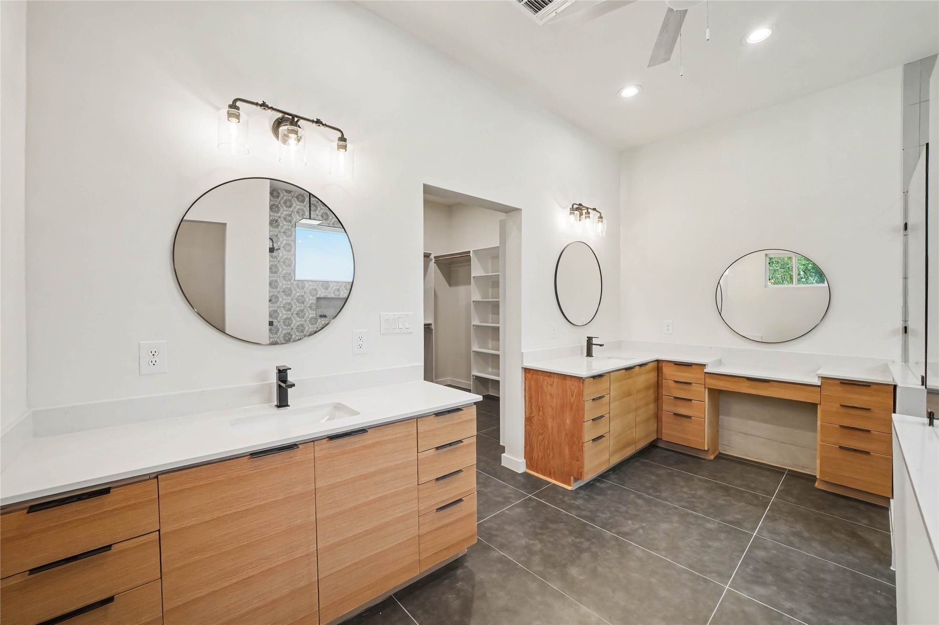 4709 Sanborn Drive, Houston, TX 77092 What's better than a big ass shower? How about not having to share vanities and sinks? LOTS of storage, lighting and even a lower counter for getting ready.