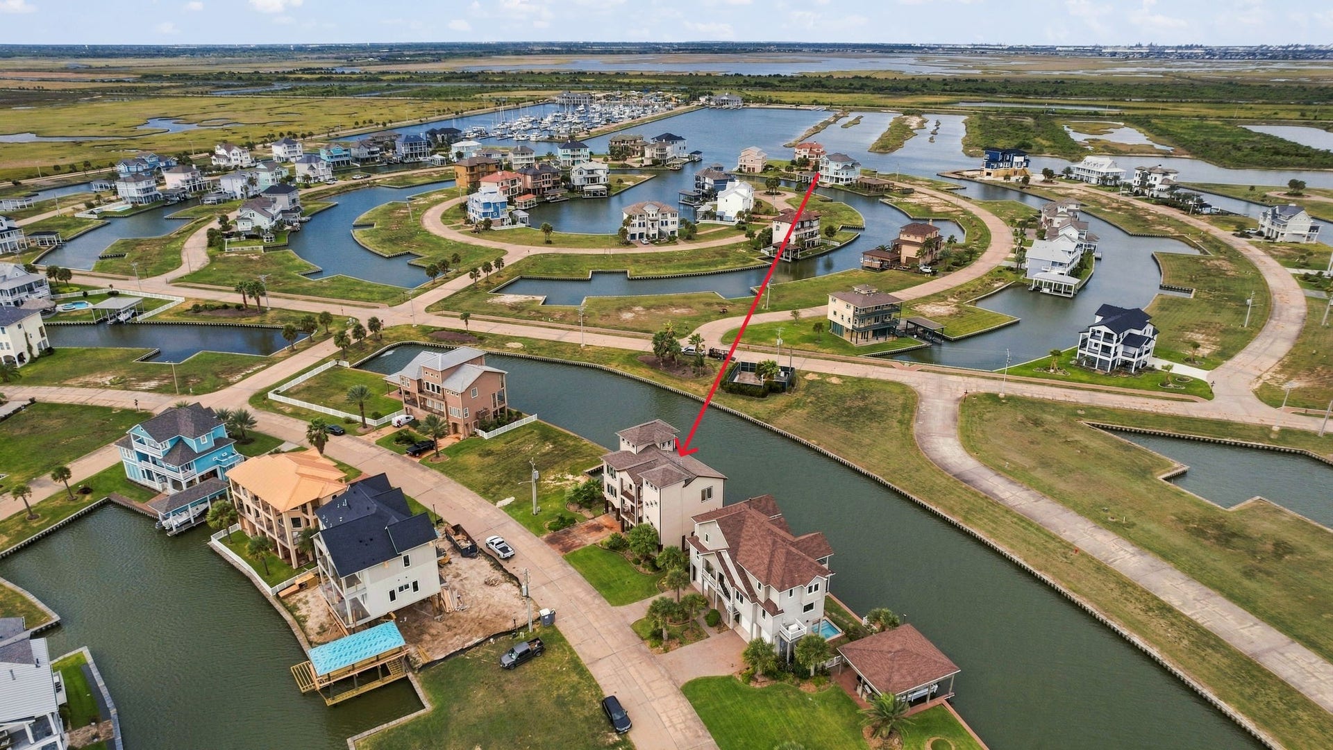 26 Half Moon, Hitchcock, TX 77563 Stunning waterfront property nestled in a serene canal community, offering picturesque views and direct water access for a perfect coastal lifestyle.