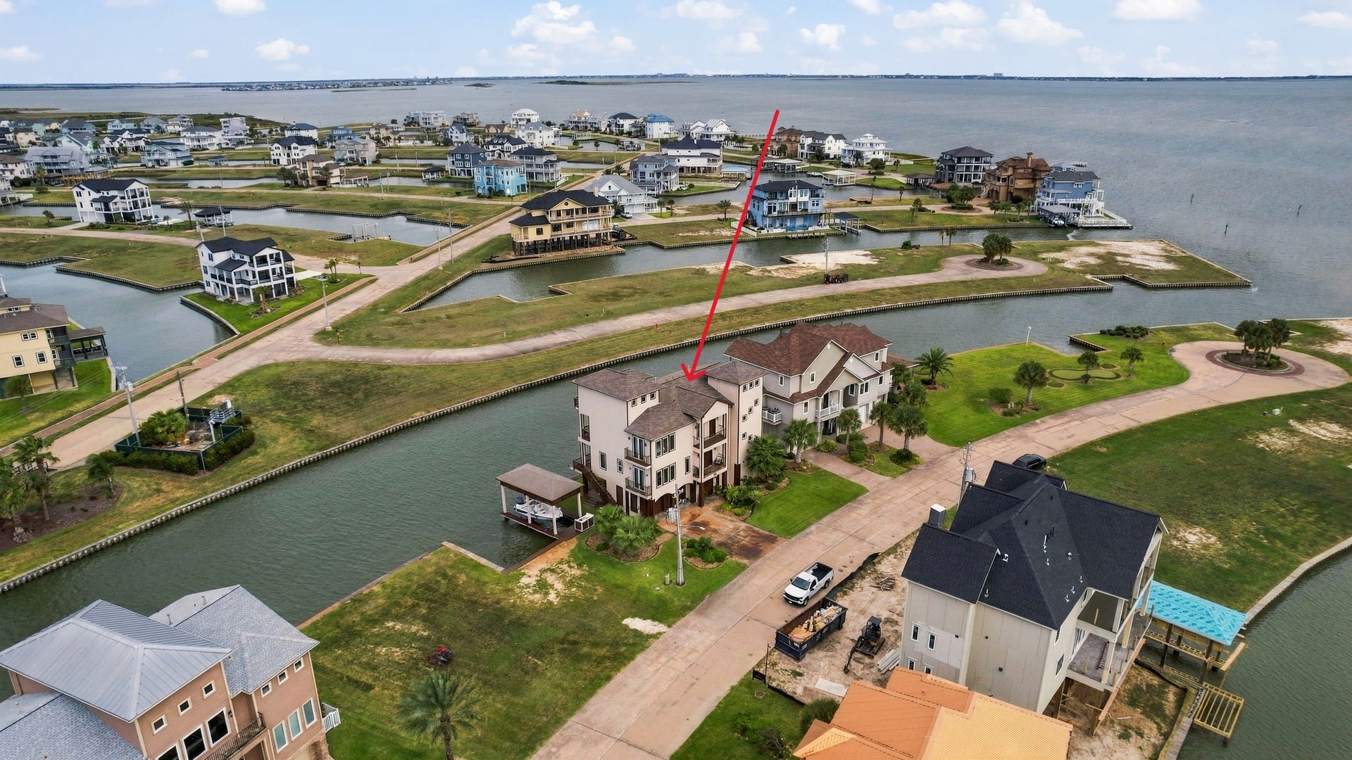 26 Half Moon, Hitchcock, TX 77563 Stunning waterfront property located on a serene canal with direct access to expansive bay views, offering a perfect blend of luxury and tranquility.