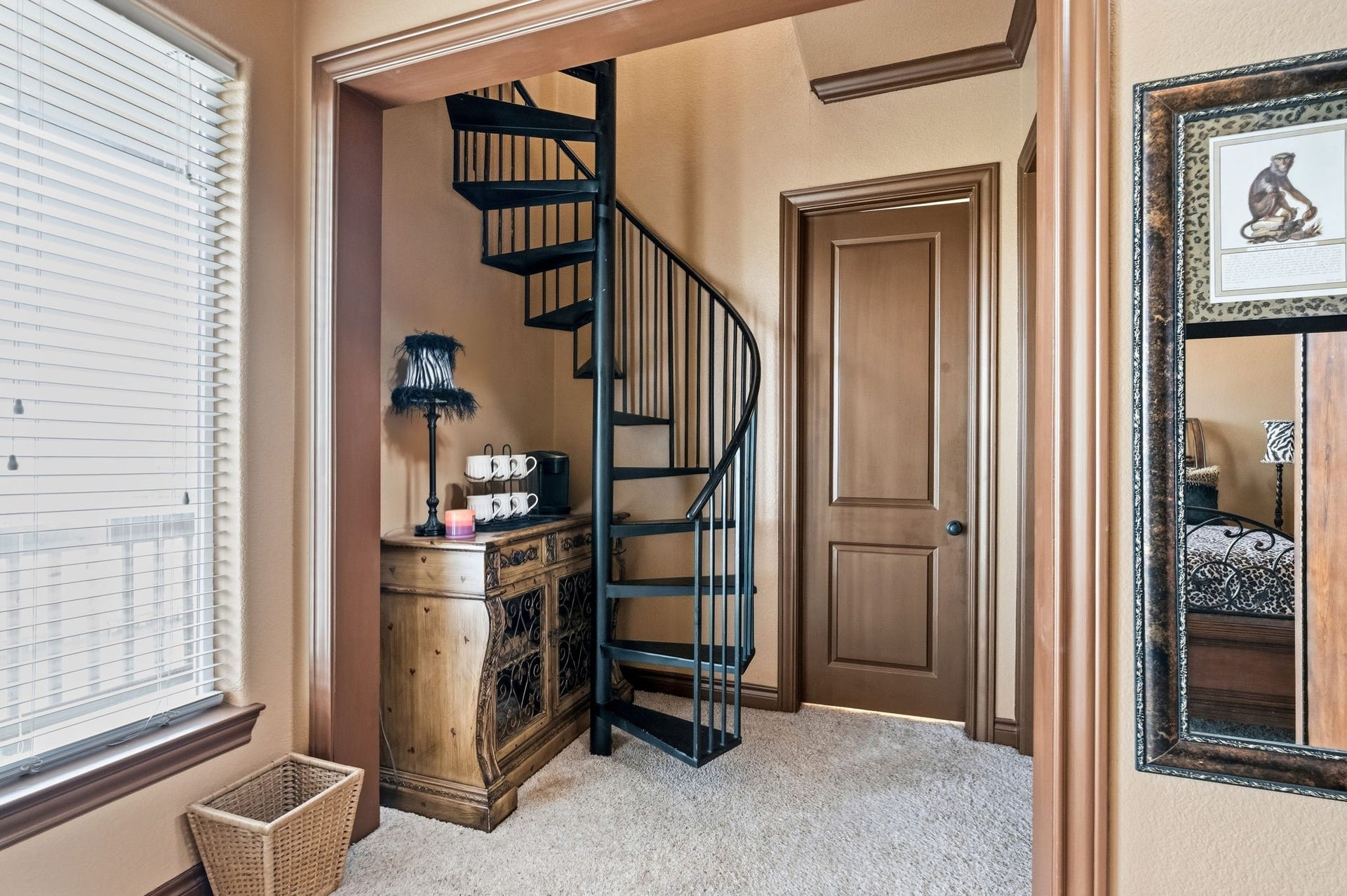 26 Half Moon, Hitchcock, TX 77563 Charming nook featuring a stylish spiral staircase, warm wood accents, and natural light, offering a cozy and inviting atmosphere.
