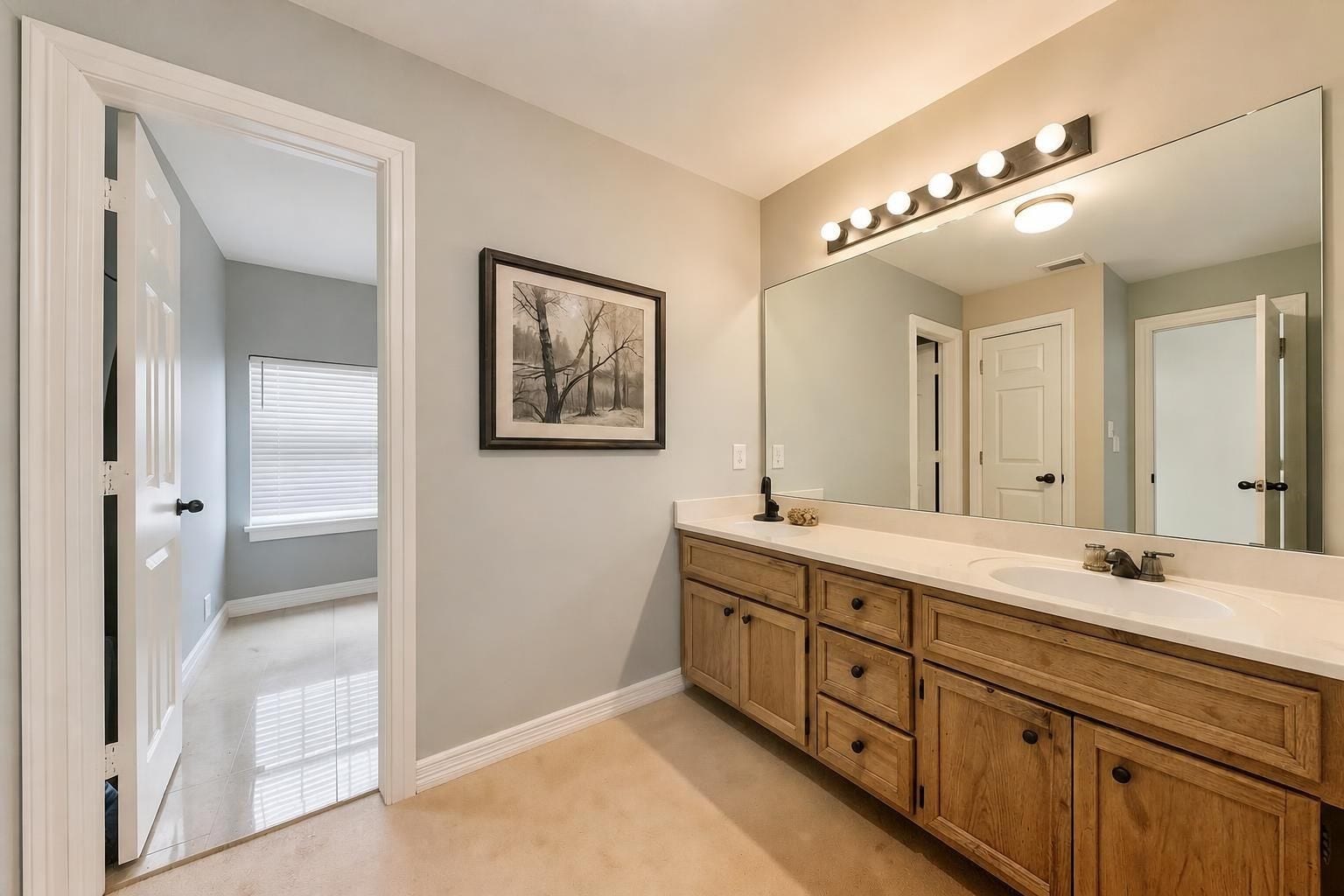 4907 Cambridge Street, Sugar Land, TX 77479 The secondary bathroom has a large vanity with double sinks. Virtually remodeled.