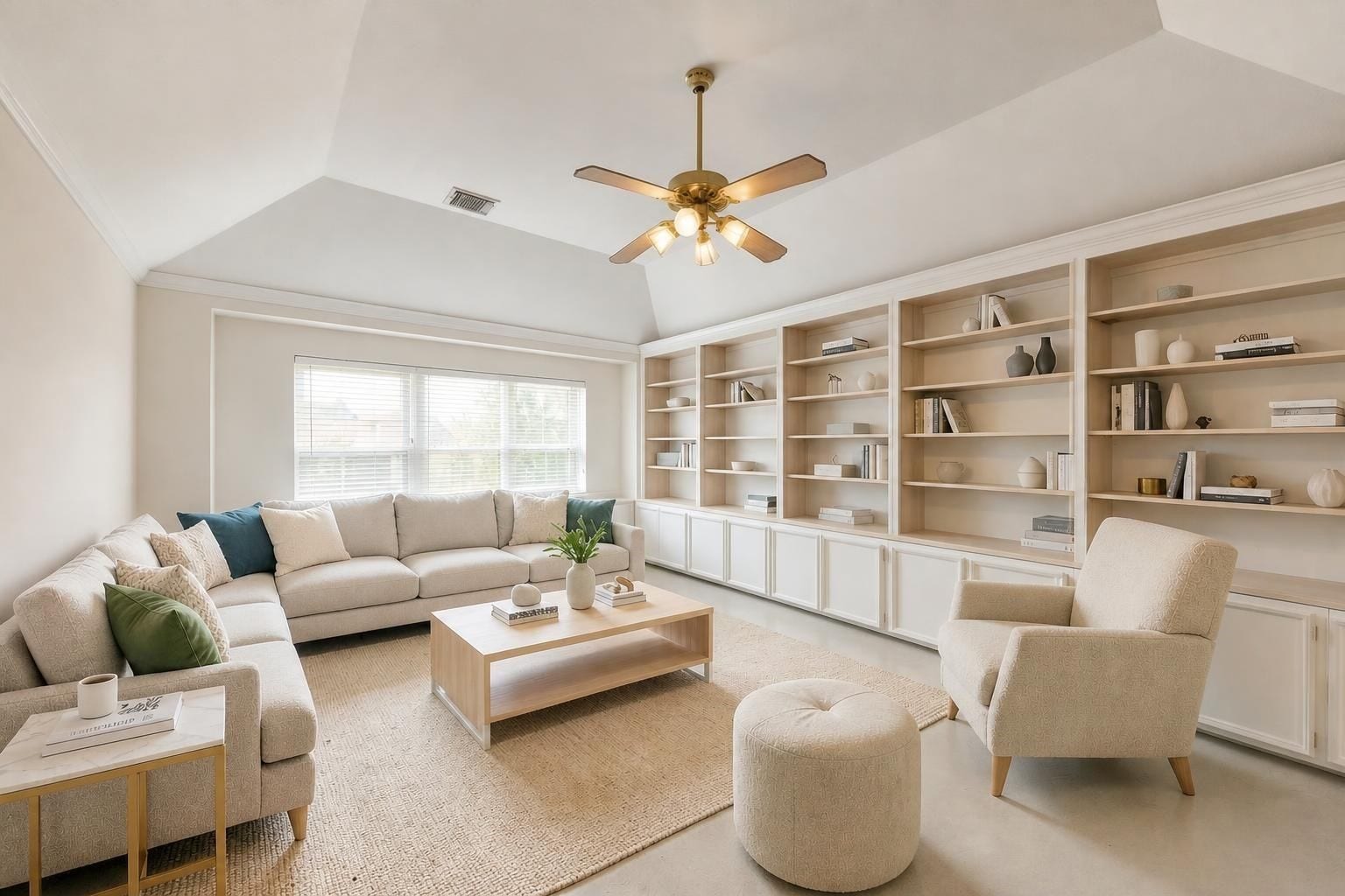 4907 Cambridge Street, Sugar Land, TX 77479 This family room comes with build in shelves for an immense amount of storage and a large window for added light. Virtually staged.