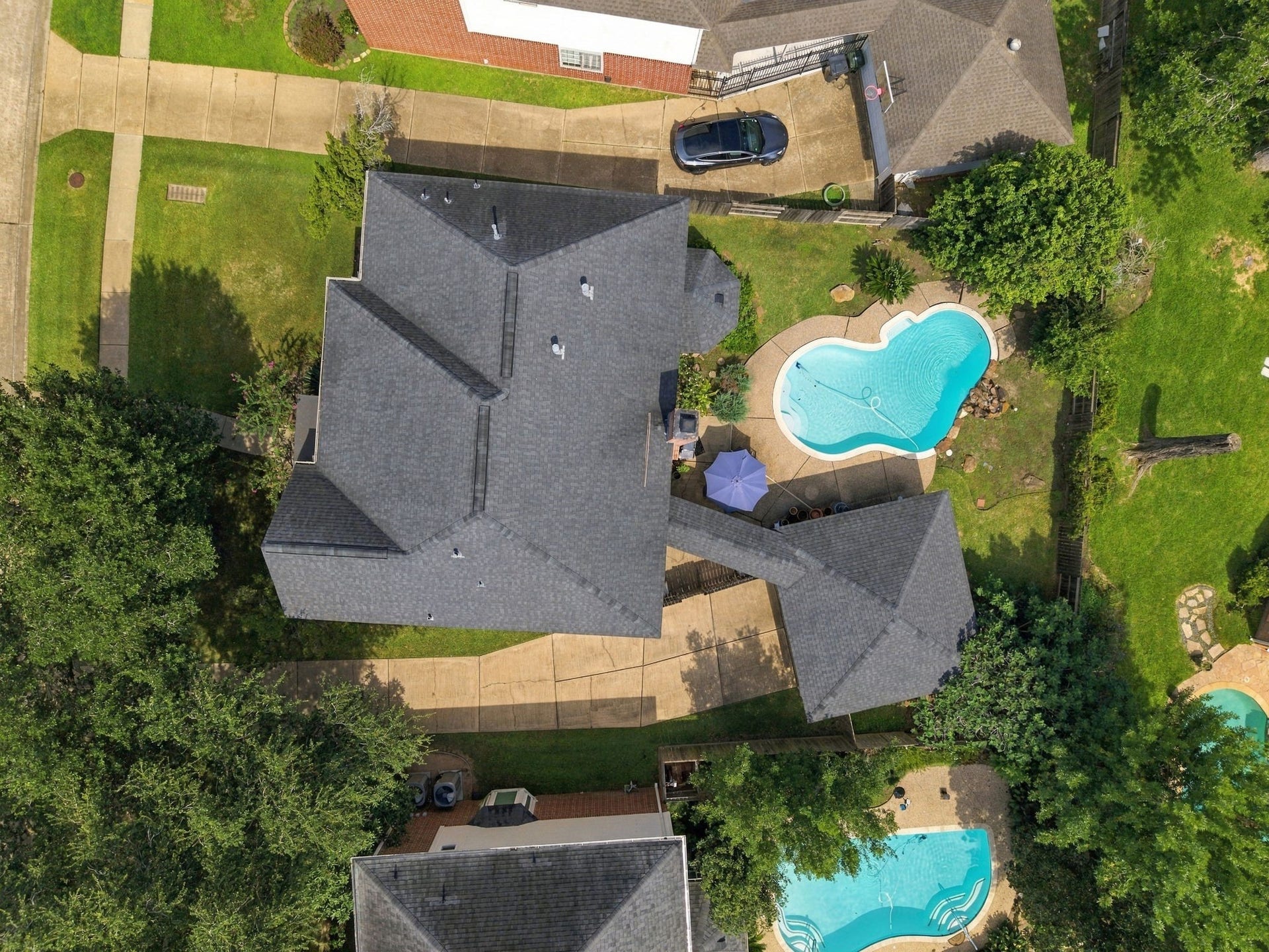 4907 Cambridge Street, Sugar Land, TX 77479 This top down angle of the home shows off the back yard and in ground pool.