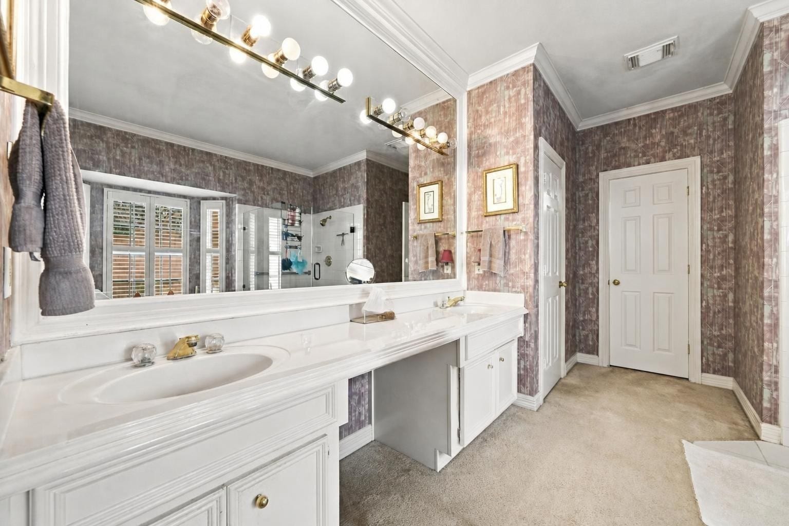 4907 Cambridge Street, Sugar Land, TX 77479 The primary en suite with a large vanity and a linen closet for more space.
