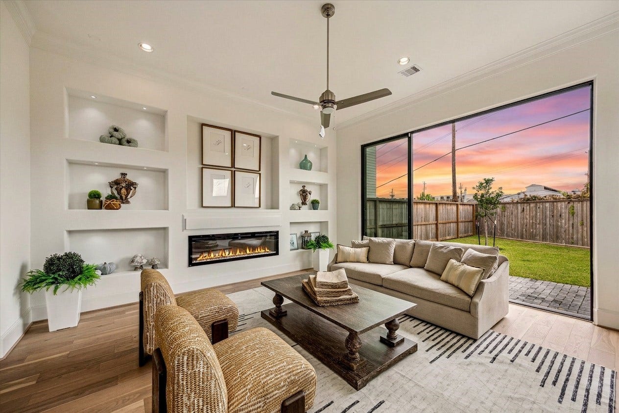 1008 Golden Nectar, Houston, TX 77008 gorgeous living room area with builtins and 12 ft ceilings and large sliding glass door 10ft tall for seamless indoor/outdoor living