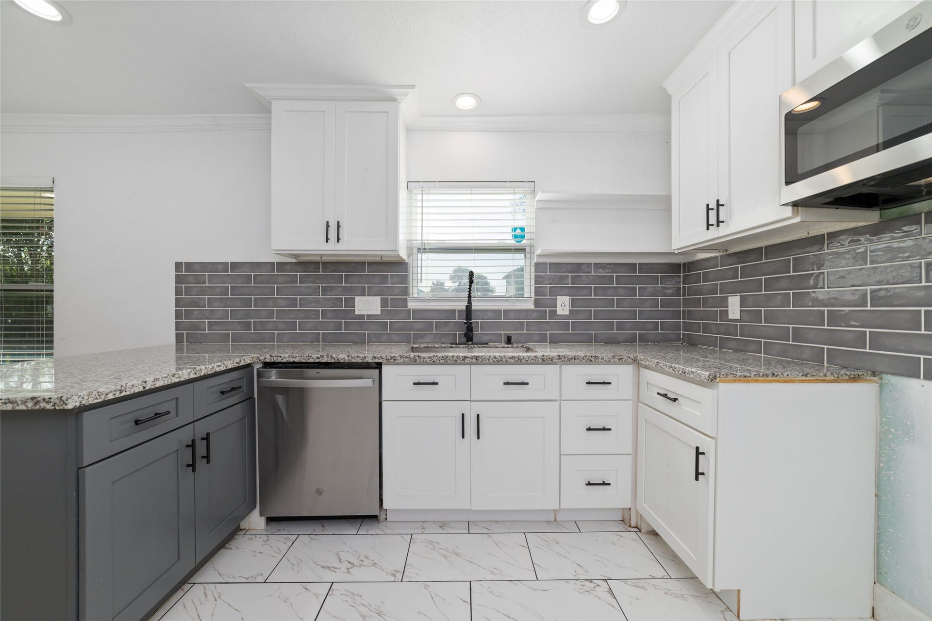 7125 Conley Street, Houston, TX 77021 Modern kitchen with plenty of counter space and cabinets and recessed lighting.