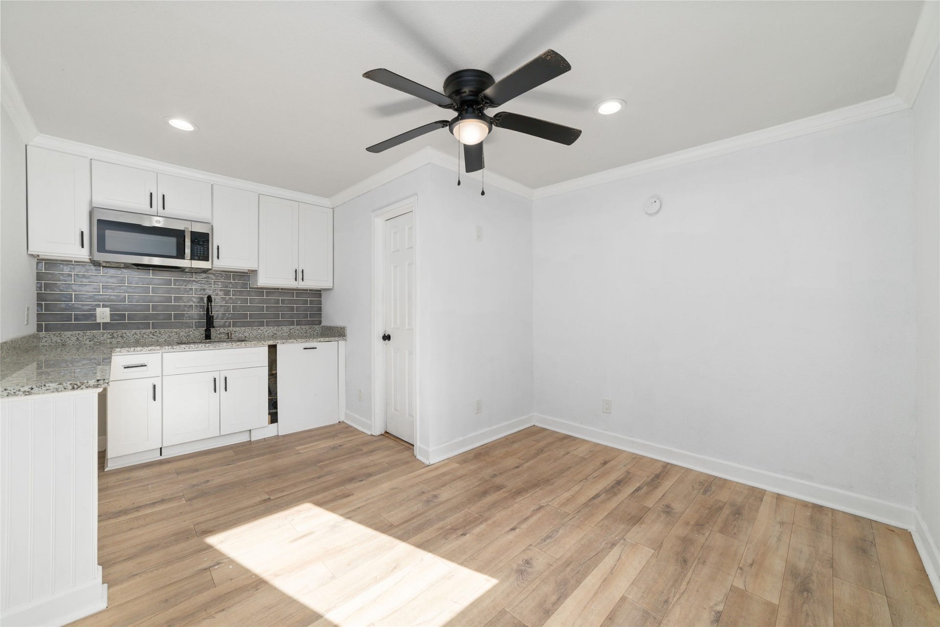 7125 Conley Street, Houston, TX 77021 A look inside one of the dwellings that has a mini kitchen with a sink and microwave and full bathroom.