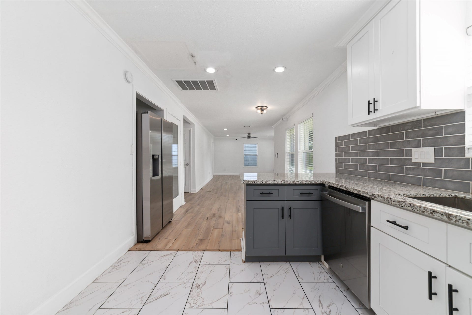 7125 Conley Street, Houston, TX 77021 All stainless steel appliances in this kitchen including a fridge, dishwasher and microwave.