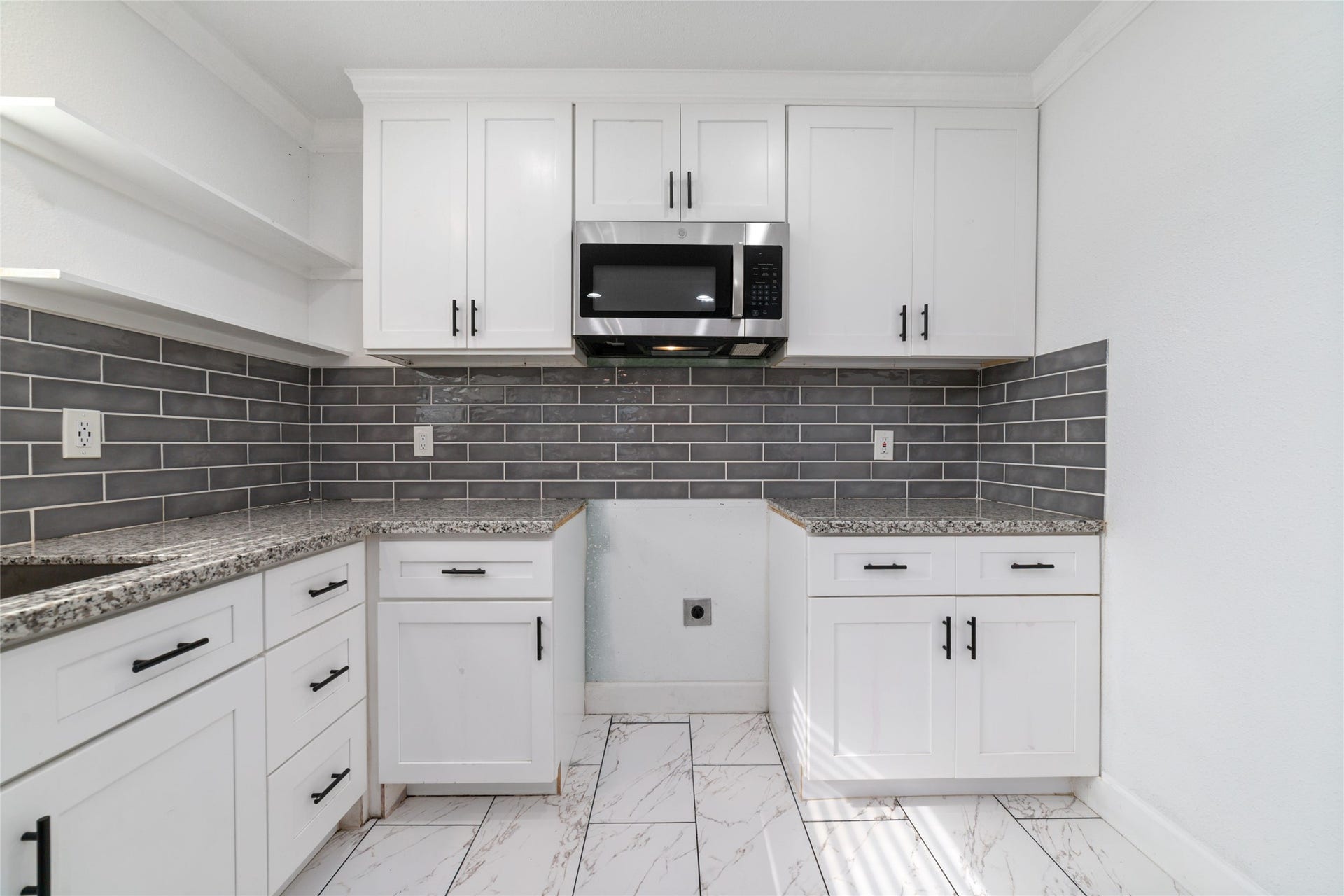7125 Conley Street, Houston, TX 77021 A brand new GE stove and electric cooktop has been purchased for this beautiful kitchen.