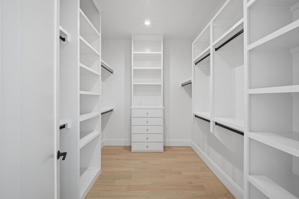 1320 Alexander Street, #A, Houston, TX 77008 Primary walk-in closet with custom built-ins.