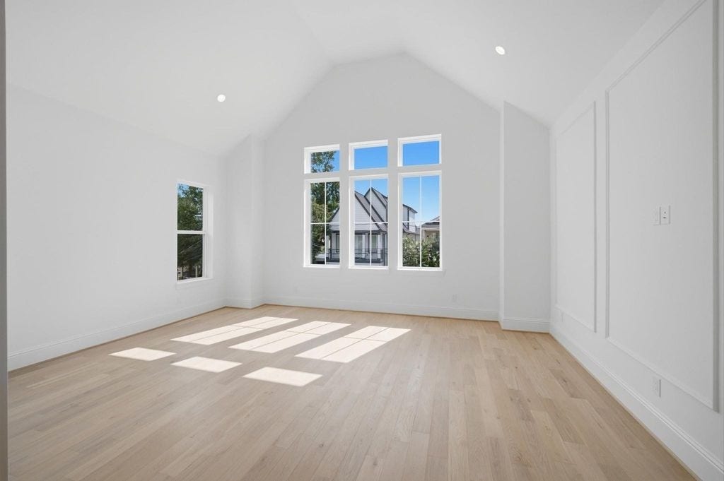 1320 Alexander Street, #A, Houston, TX 77008 Primary bedroom features vaulted ceilings and abundant natural light.