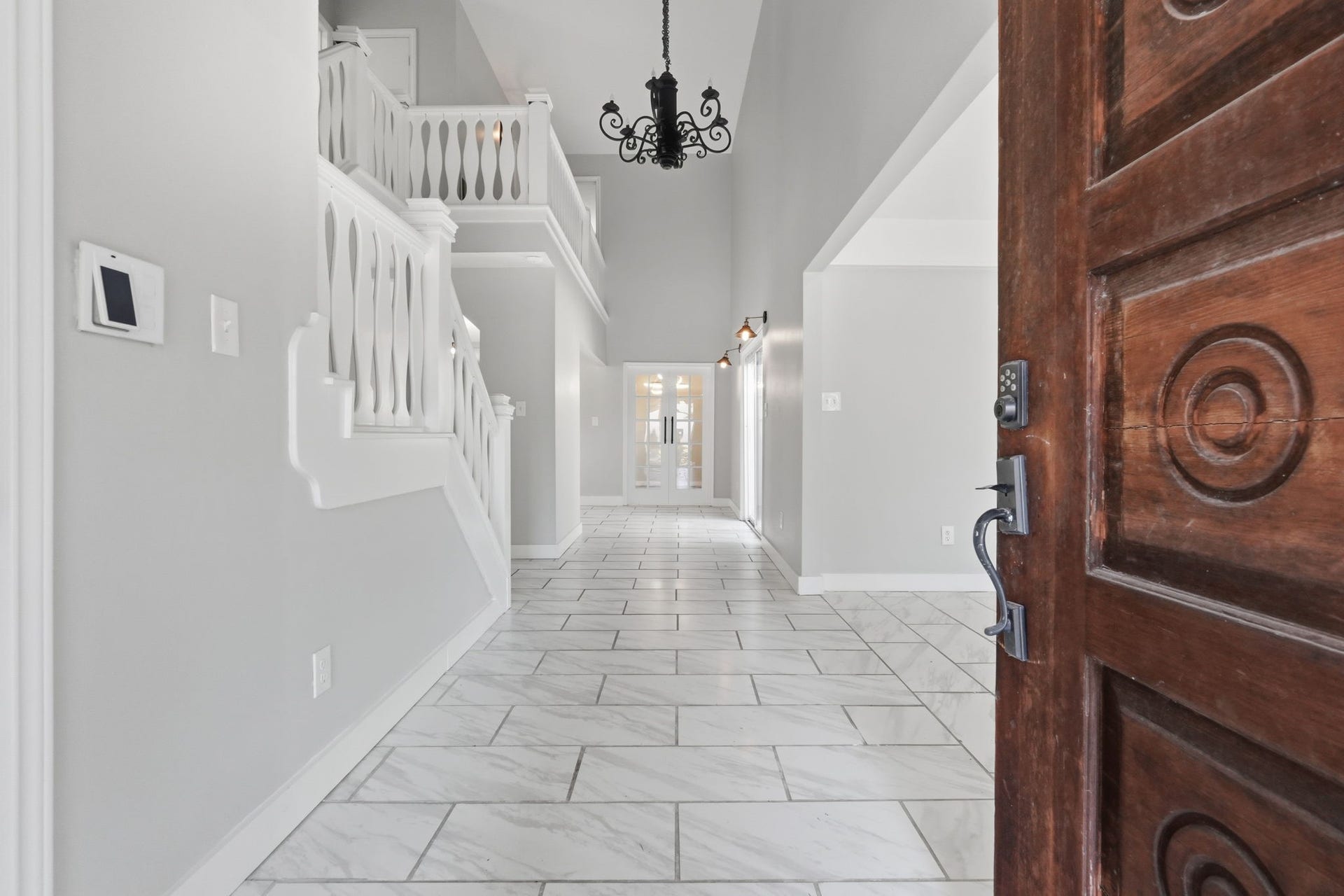 This grand entry welcomes you into a bright and spacious area.