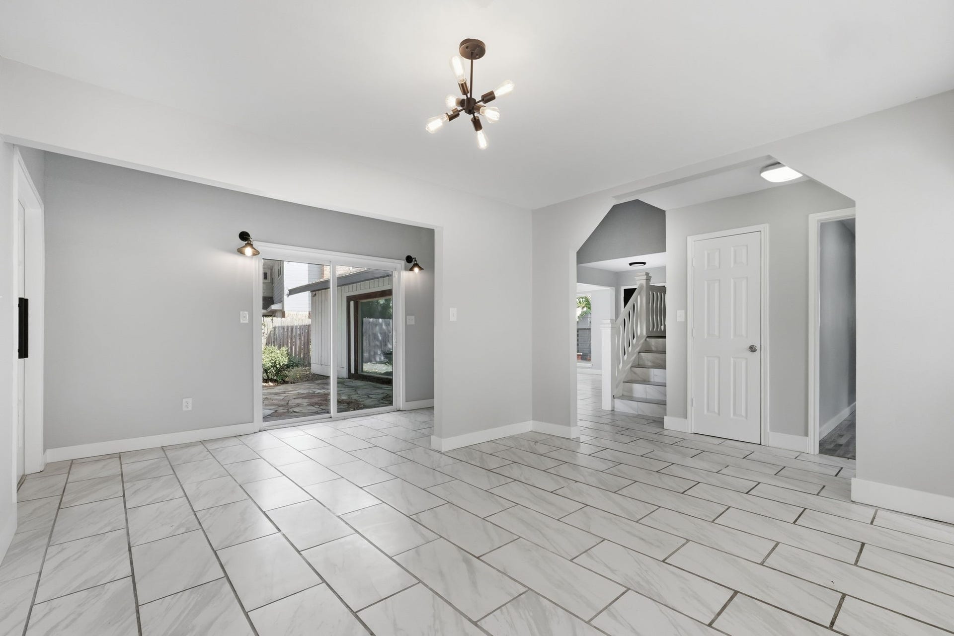 This dining area offers convenient access to the patio with large sliding glass doors.