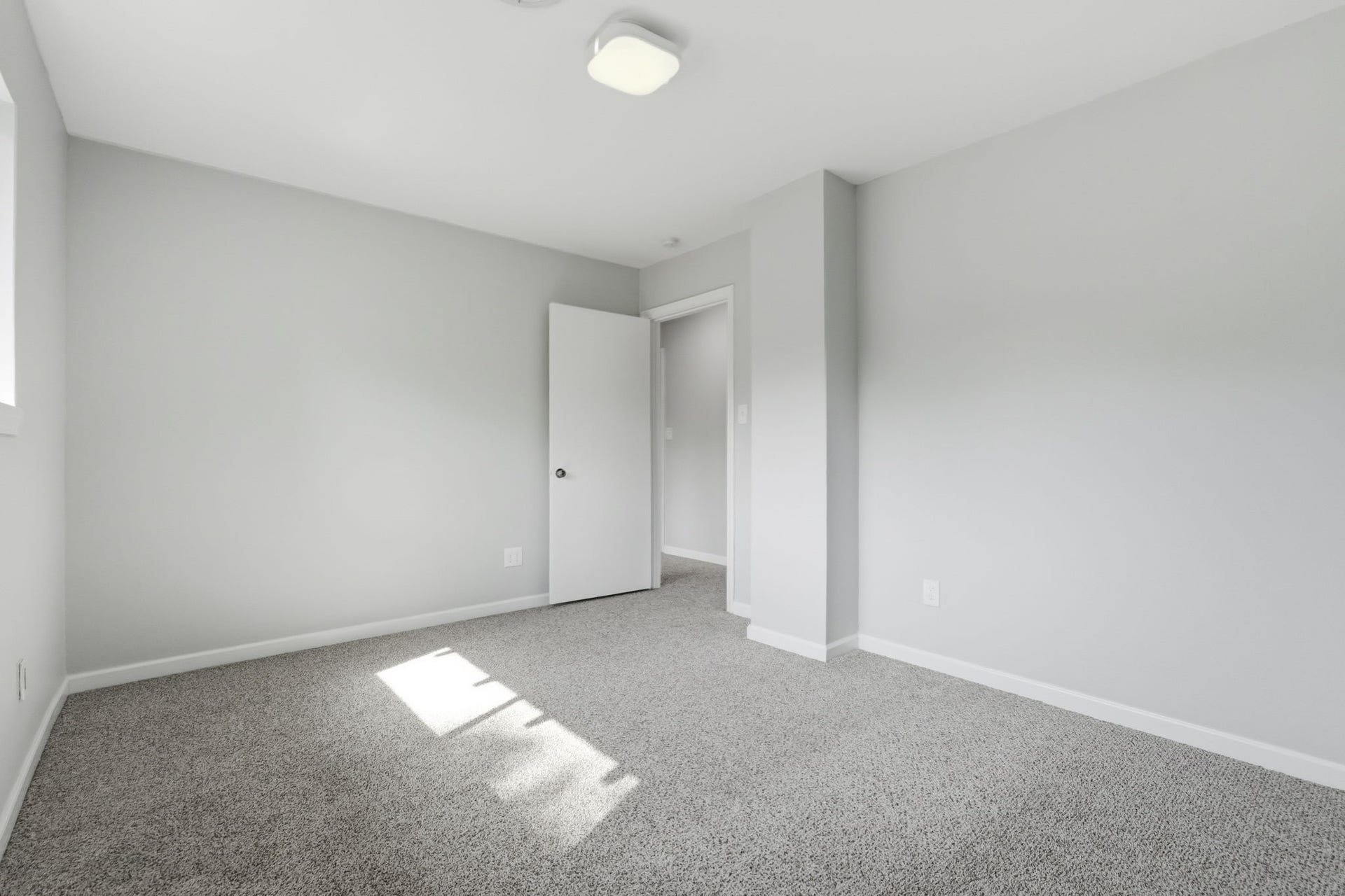 This bedroom is bright and inviting, perfect for a cozy space.