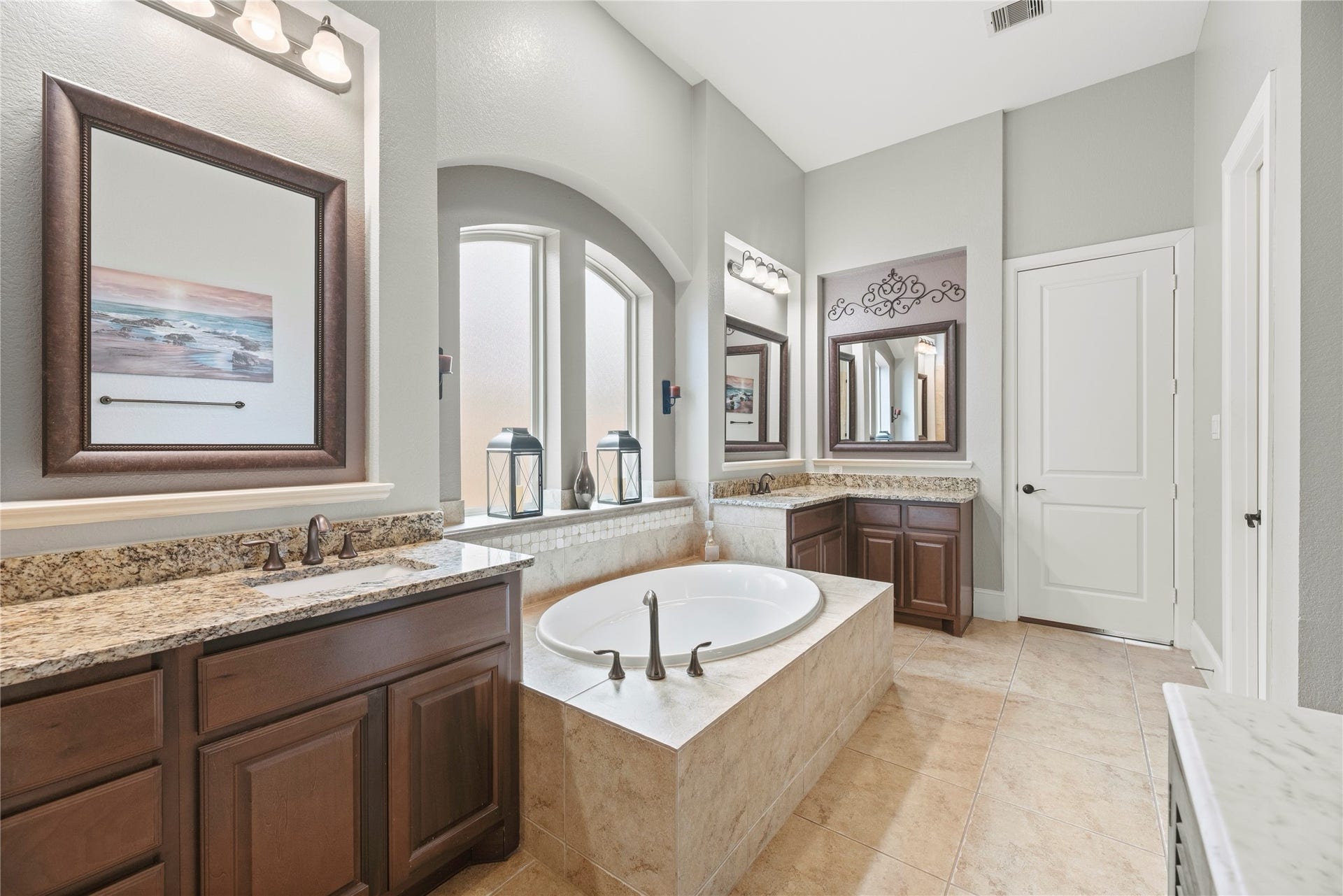 6115 Duke Trail Lane, Sugar Land, TX 77479 Beautiful primary bathroom featuring a large soaking tub, split vanities, granite countertops, and beautiful cabinetry.
