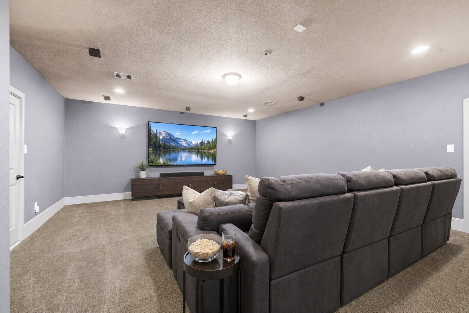 6115 Duke Trail Lane, Sugar Land, TX 77479 Huge Media Room with plush carpet and ambient lighting.