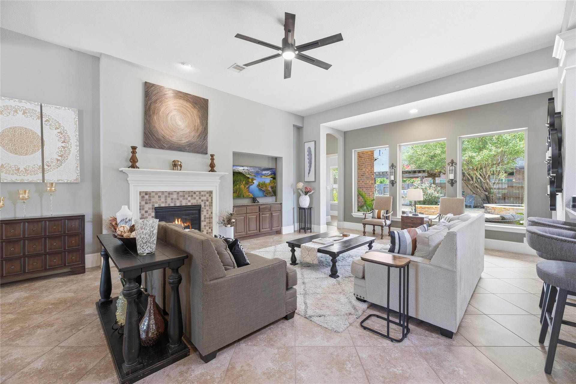 6115 Duke Trail Lane, Sugar Land, TX 77479 Spacious family room with large tile floors, gorgeous fireplace, and a complete energizing space.