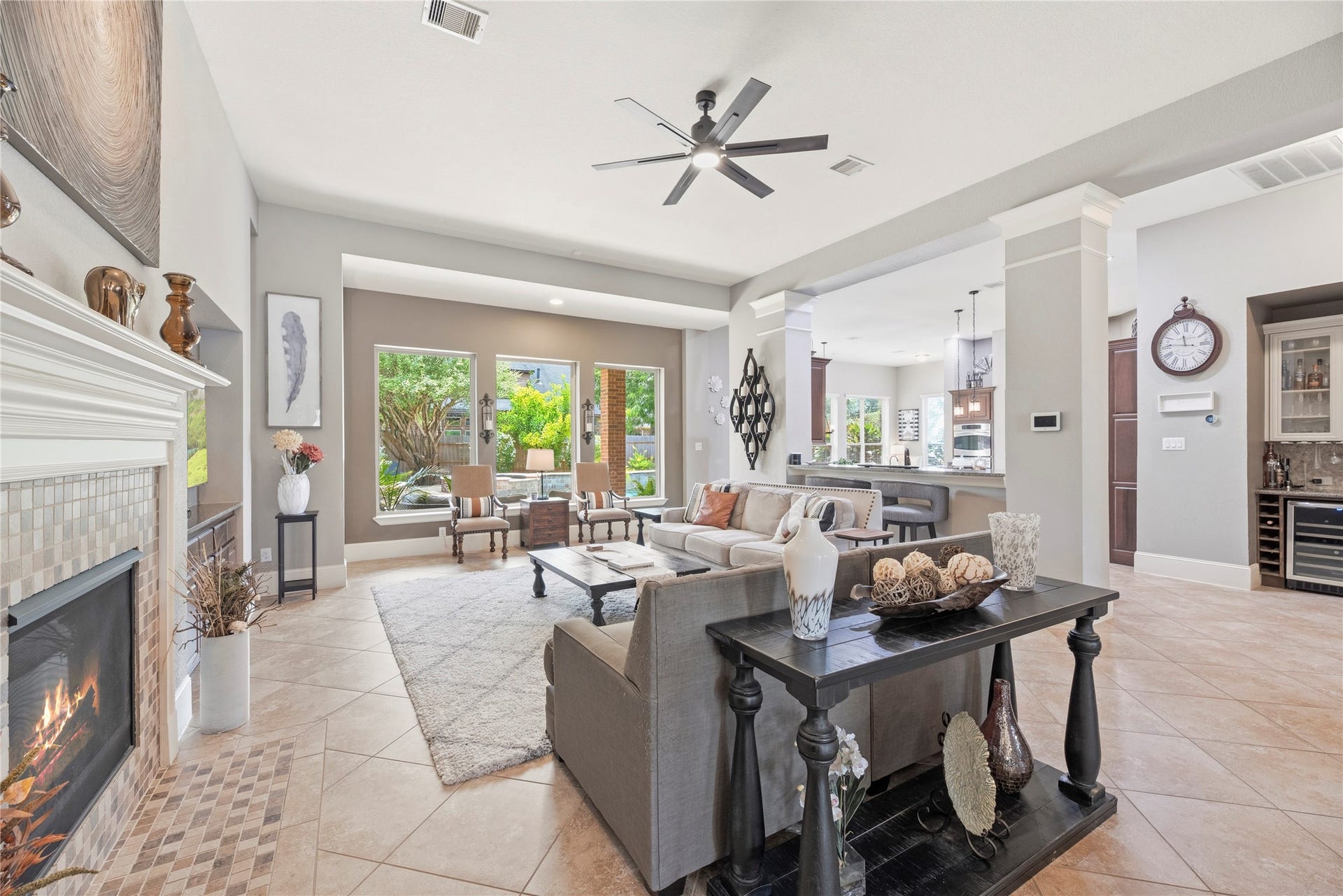 6115 Duke Trail Lane, Sugar Land, TX 77479 Spacious family room with large tile floors, gorgeous fireplace, and a complete energizing space.