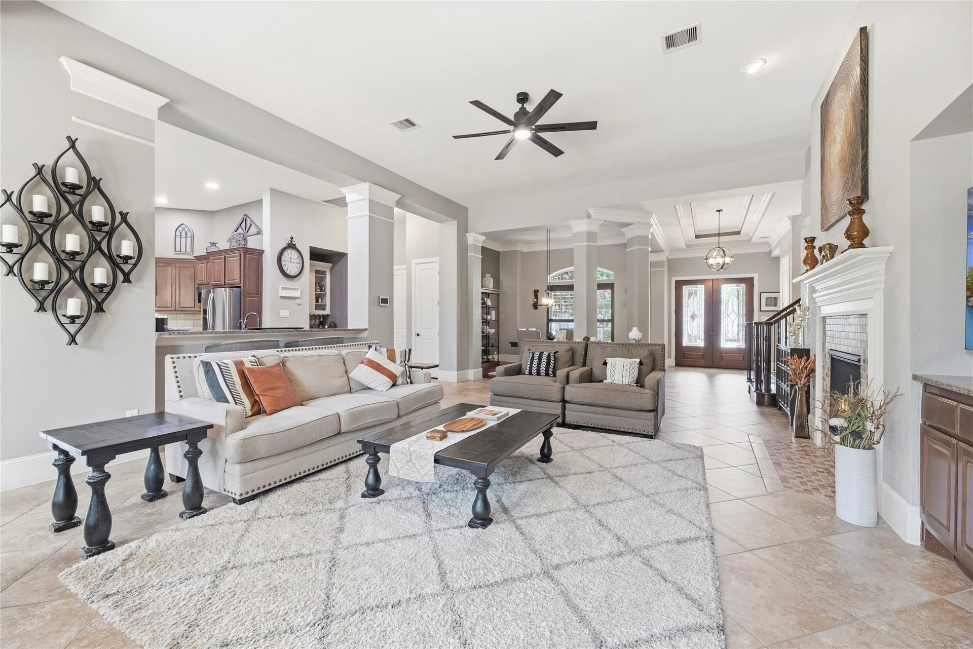 6115 Duke Trail Lane, Sugar Land, TX 77479 Spacious family room with large tile floors, gorgeous fireplace, and a complete energizing space.