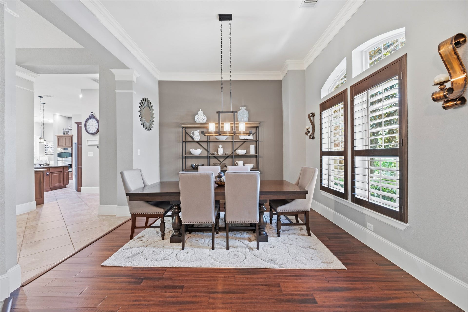 6115 Duke Trail Lane, Sugar Land, TX 77479 Host the next dinner party with confidence with this classy formal dining space. Featuring plantation shutters, crown molding, and an elegant light fixture.