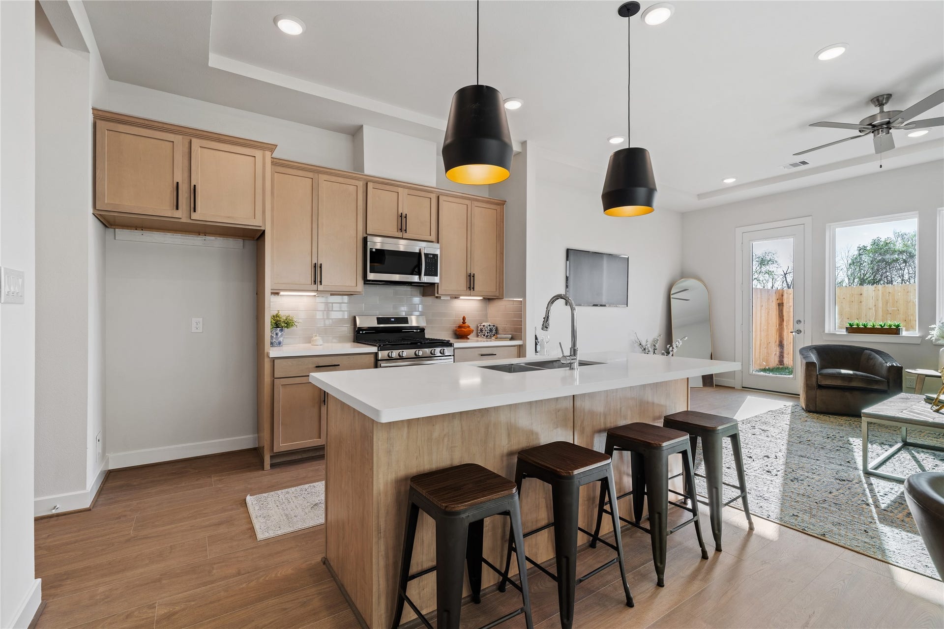 6441 Rena Street, Houston, TX 77092 Engineered hardwood runs continuously from the kitchen through the dining and into the living area, tying the whole first floor together.
