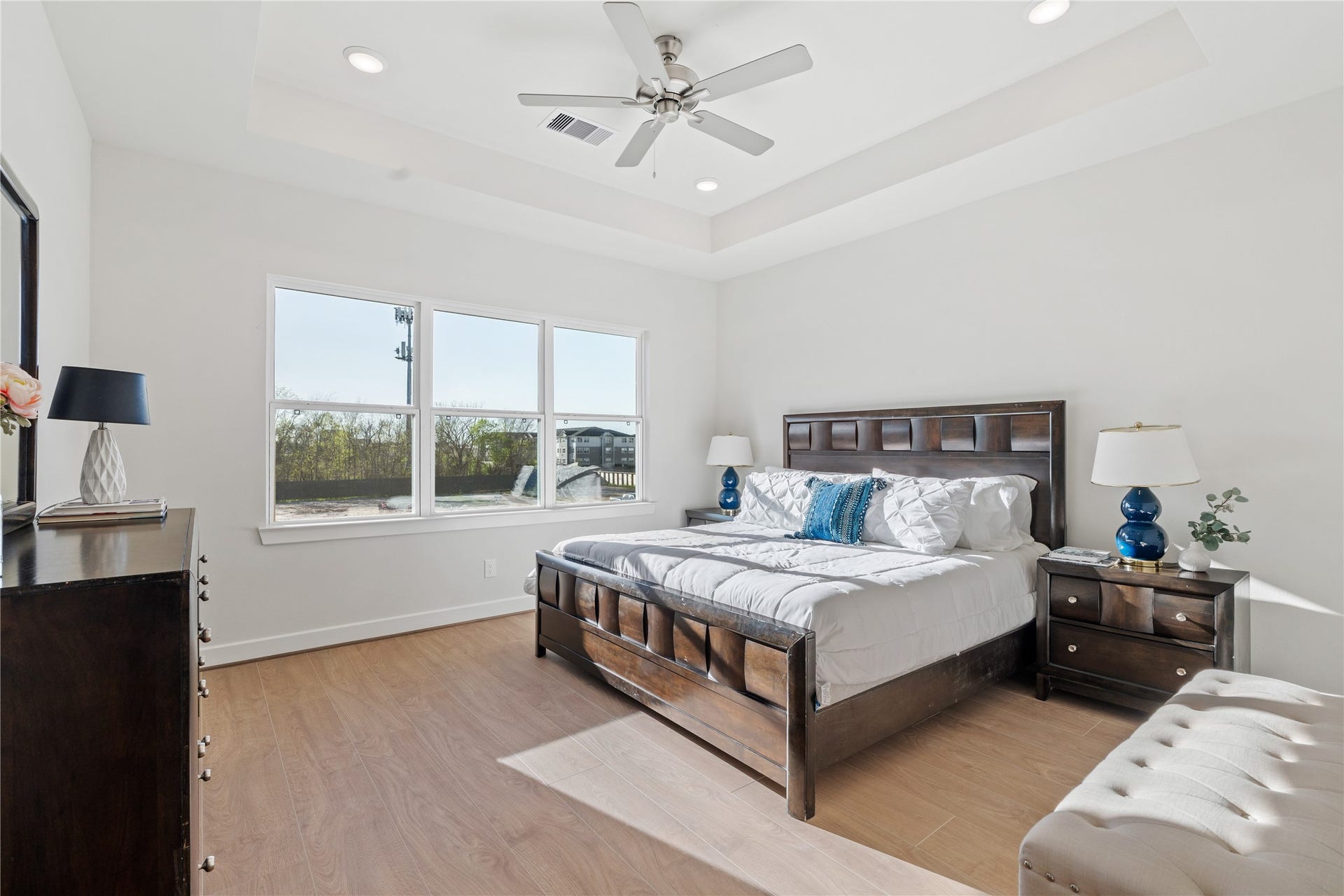 6441 Rena Street, Houston, TX 77092 Spacious primary suite with a tray ceiling, wide rear window, and enough room for a king setup without the space feeling crowded.