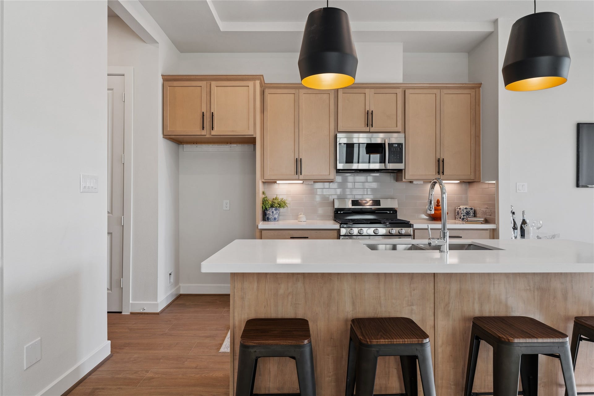 6441 Rena Street, Houston, TX 77092 White subway tile, shaker cabinets, and stainless Samsung appliances make the kitchen a working space that actually looks good.