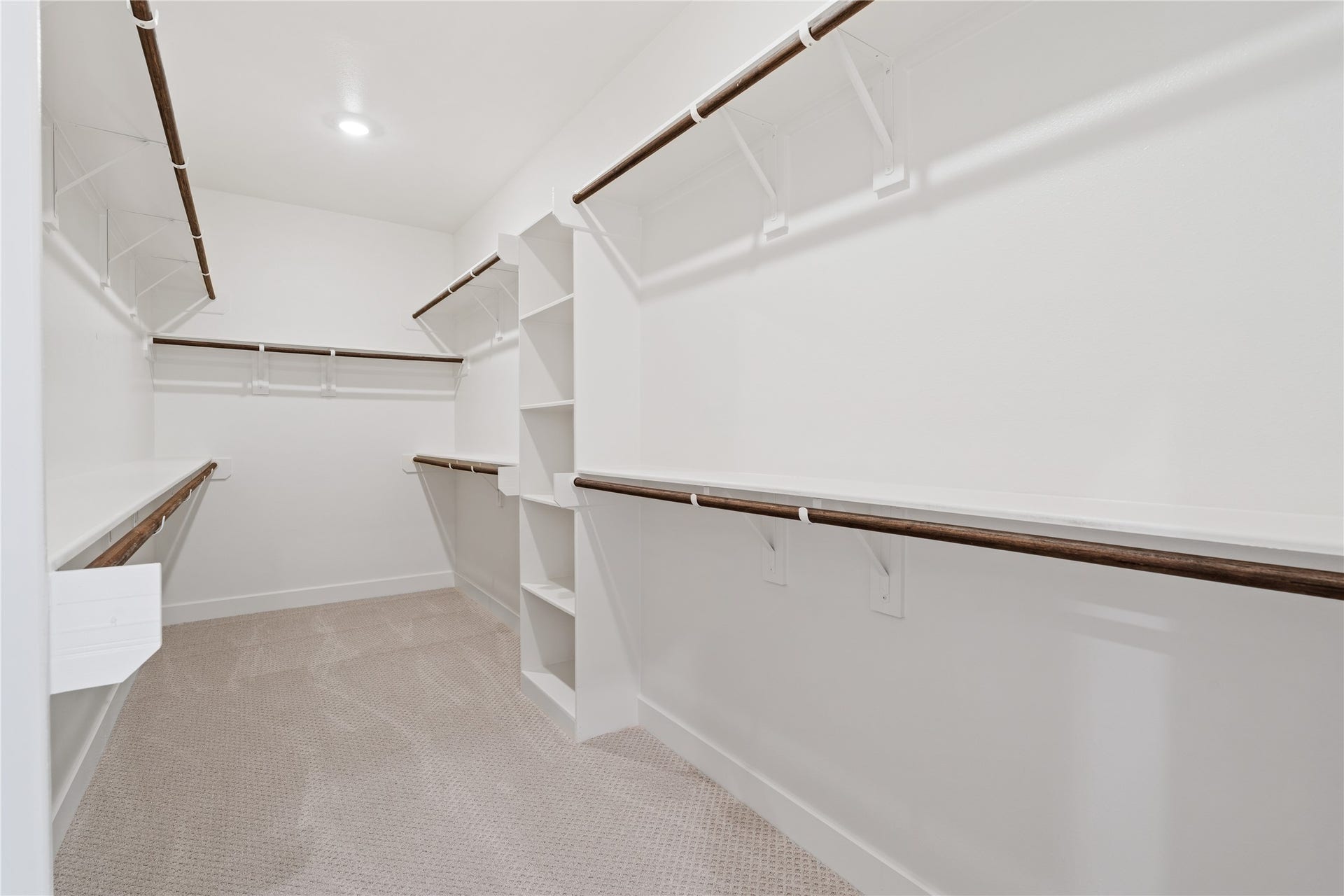 6441 Rena Street, Houston, TX 77092 Primary walk-in closet with built-in shelving and double hanging rods on multiple walls, so your wardrobe actually has a place to live.
