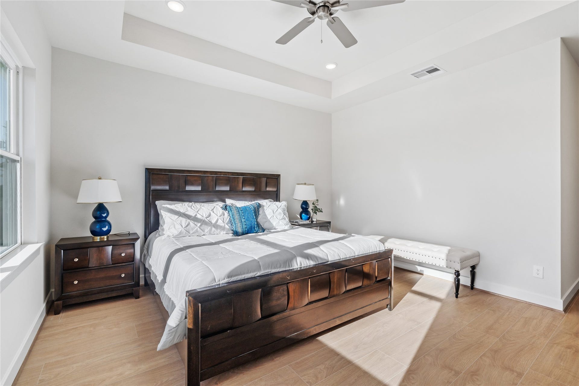 6441 Rena Street, Houston, TX 77092 Clean wall lines and steady natural light from the side window keep the primary suite feeling open and relaxed rather than closed off.