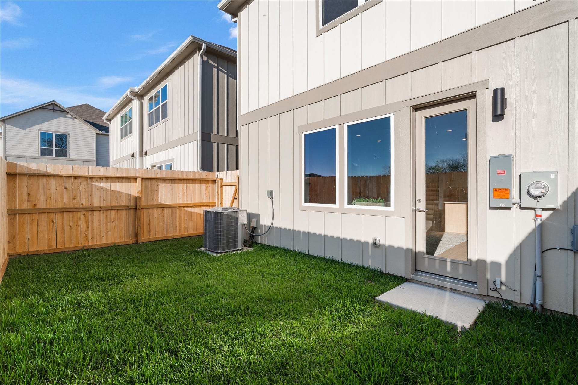 6441 Rena Street, Houston, TX 77092 Fully fenced backyard with a clean grass lot, privacy on both sides, and a direct step out from the living area a blank slate ready to use.