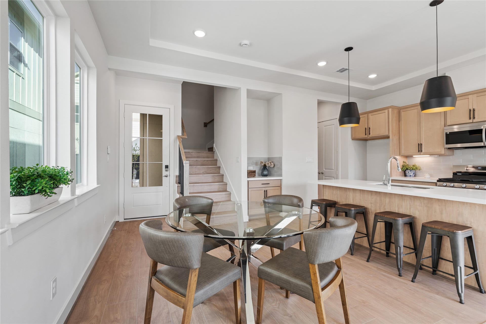 6441 Rena Street, Houston, TX 77092 Dining positioned at the center of the first floor with clear sightlines to the kitchen and stairs, keeping the layout easy to read.