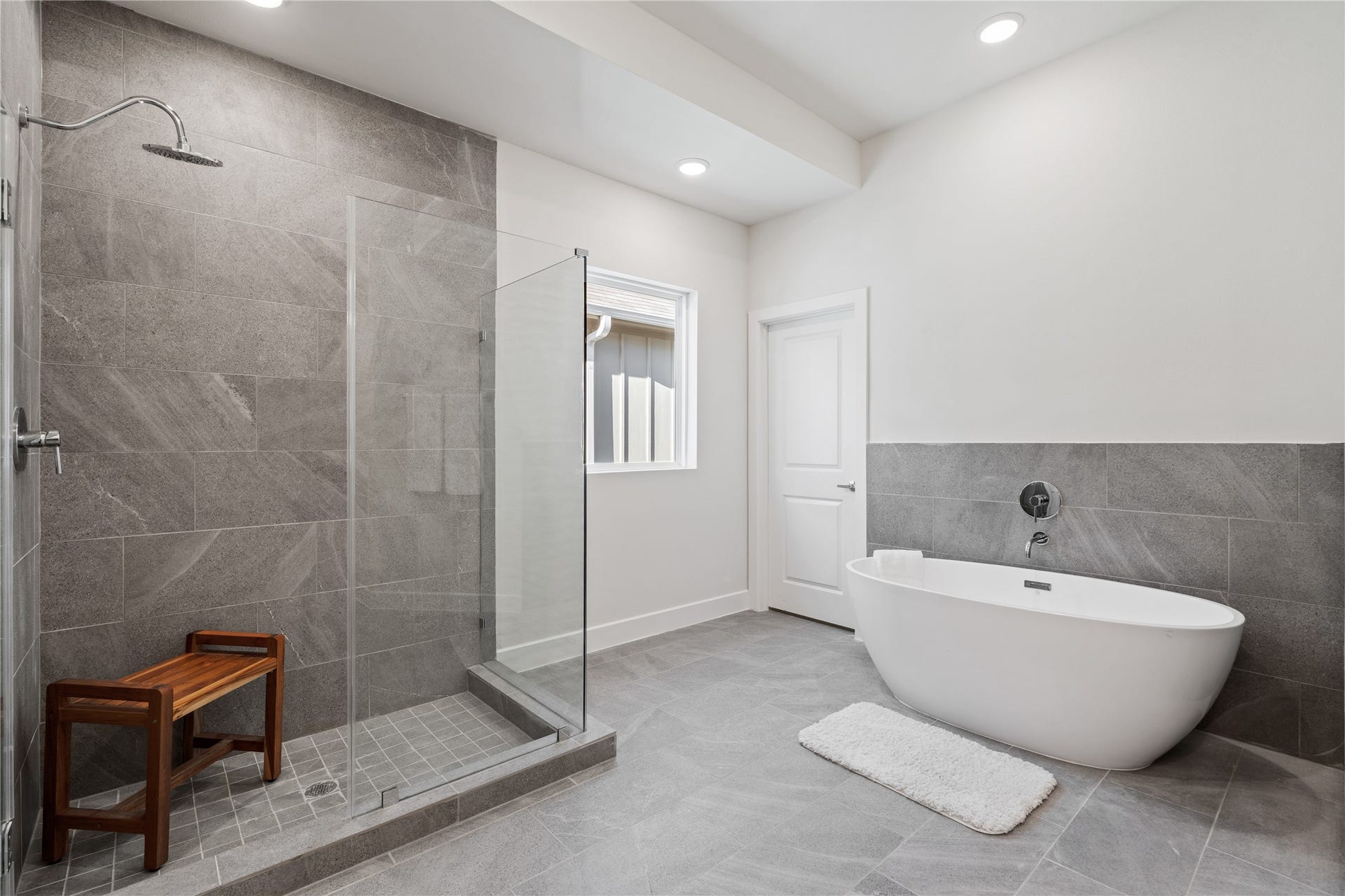 6441 Rena Street, Houston, TX 77092 The primary bath pairs a freestanding soaking tub with a glass-enclosed shower, giving you both without having to choose.