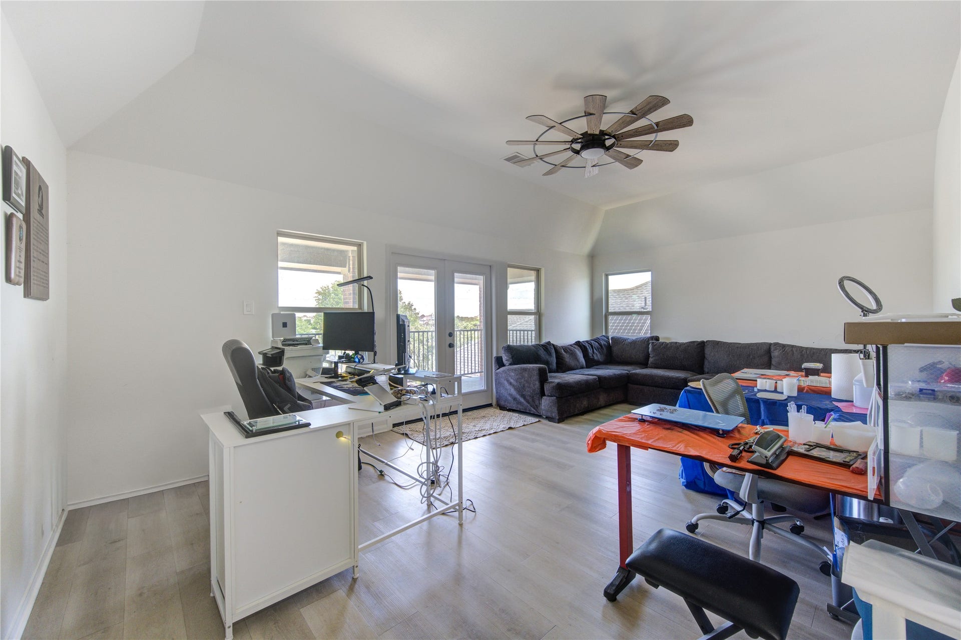 Upstairs game room offering a versatile space perfect for entertainment or relaxation, with direct access to a private balcony overlooking serene lake views. Enjoy peaceful mornings or unwind in the evening while taking in the scenic surroundingsan ideal retreat for both leisure and hosting guests.