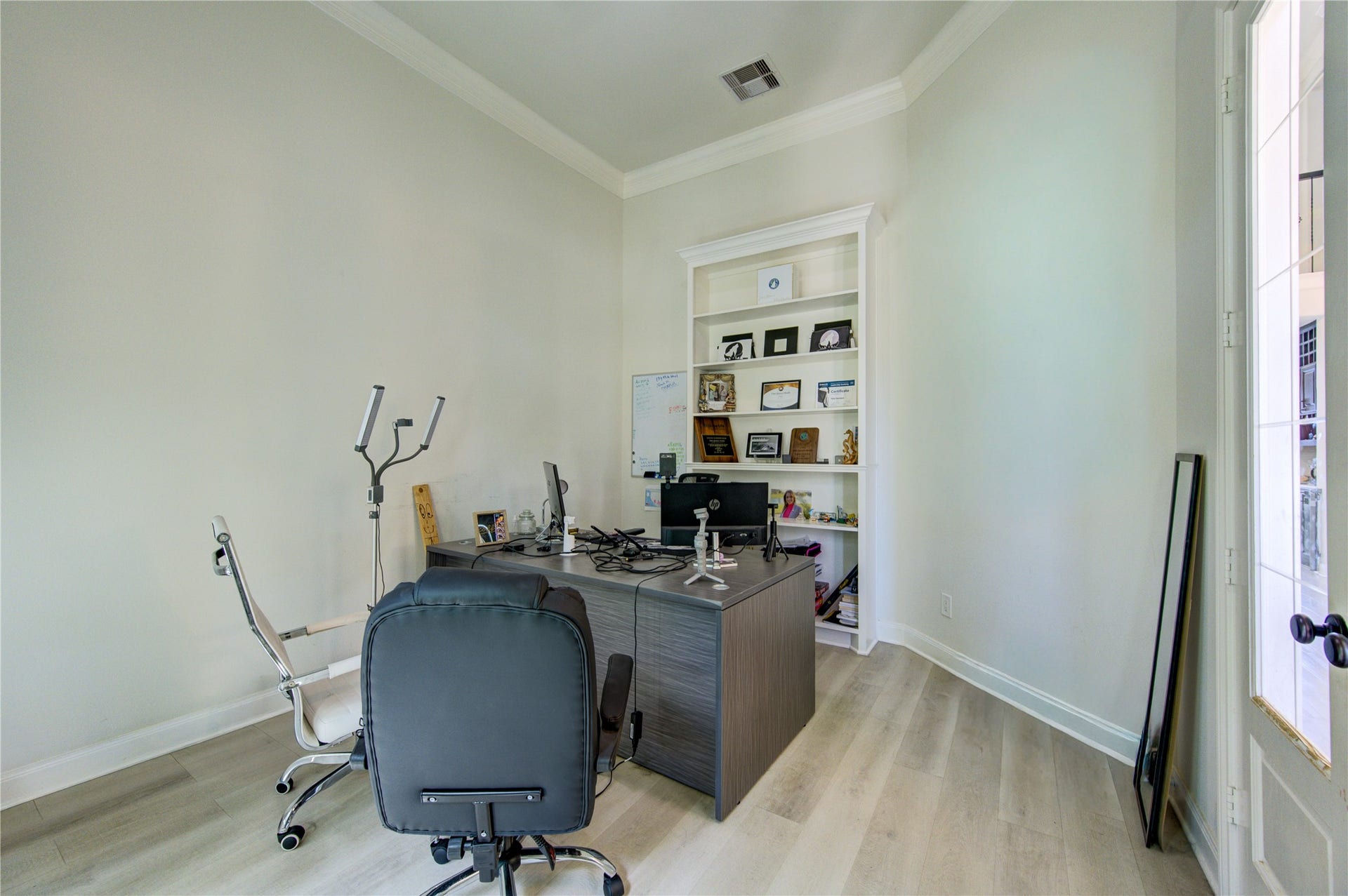 Bright and versatile home office filled with natural light from large windows, creating an inspiring and productive workspace. Featuring clean lines, neutral tones, and ample room for multiple desks or creative setups, this space is perfect for working from home, studying, or managing daily tasks. A functional layout and modern touches make it both comfortable and efficient.