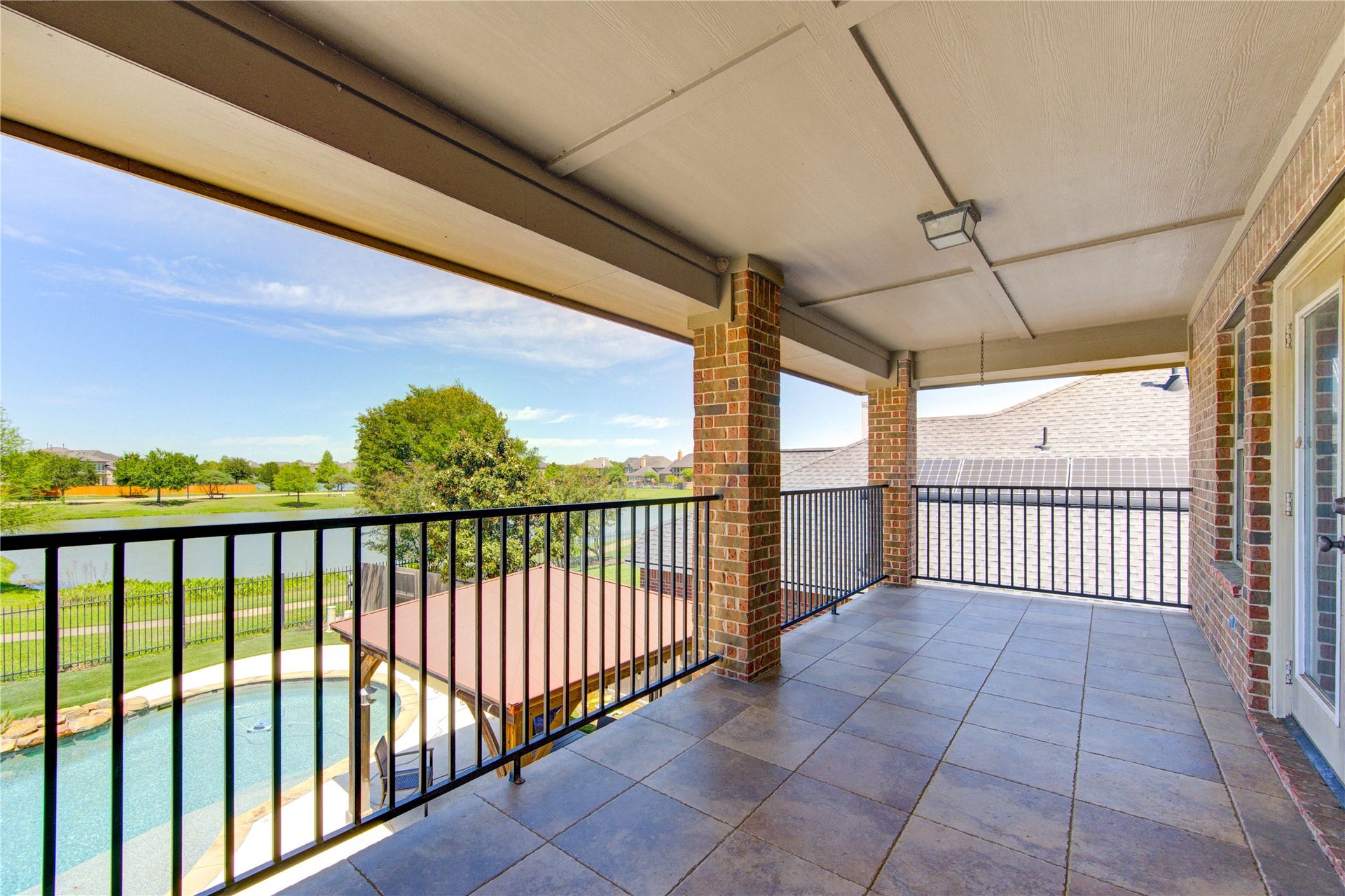 Private balcony overlooking the waterperfect for relaxing and enjoying scenic sunsets.