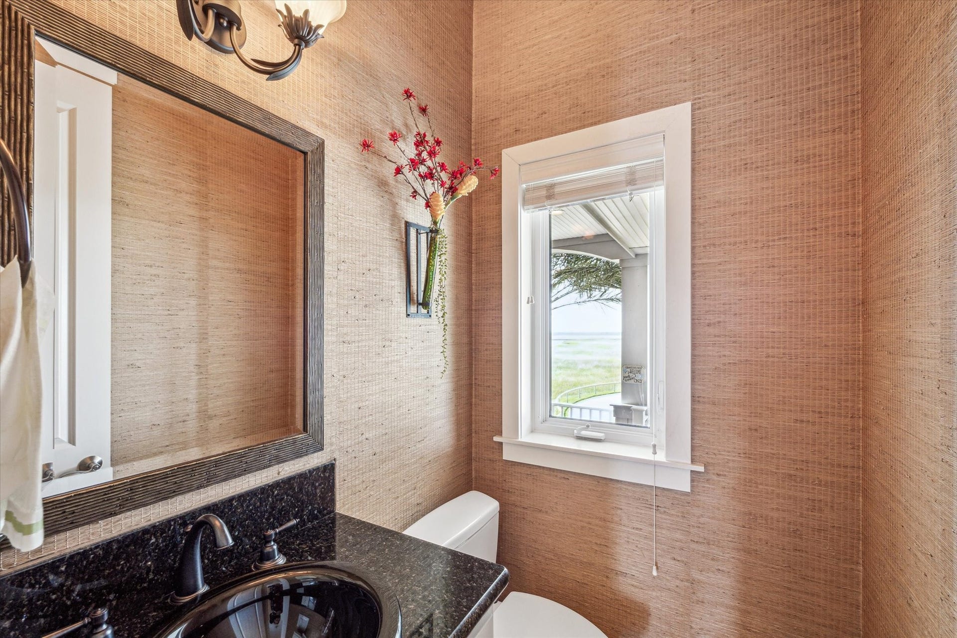 1 Shell Key, Hitchcock, TX 77563 A half bath is conveniently located next to the elevator on the main level