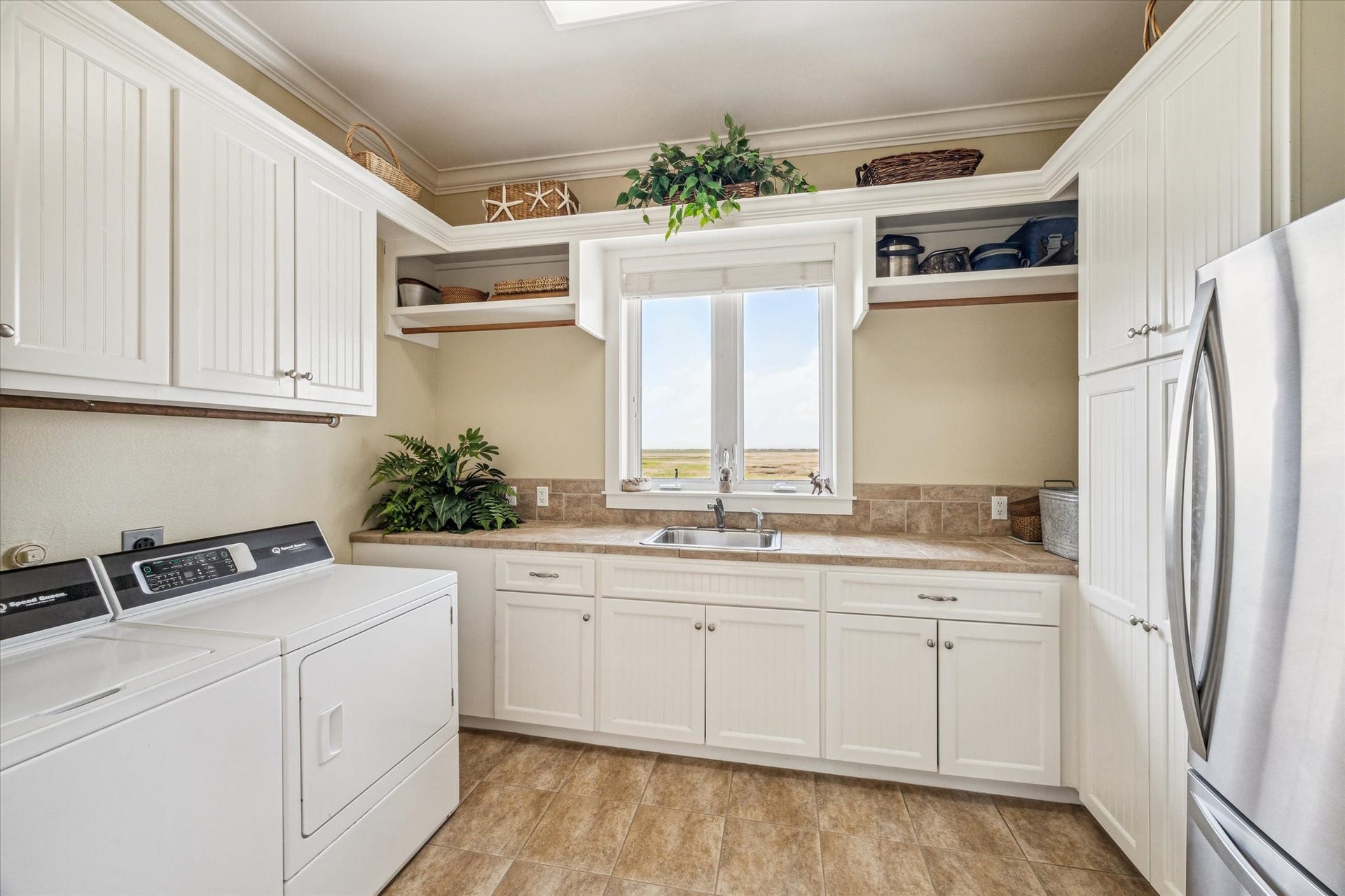 1 Shell Key, Hitchcock, TX 77563 Generously sized laundry room featuring dedicated space for a second refrigerator or freezer